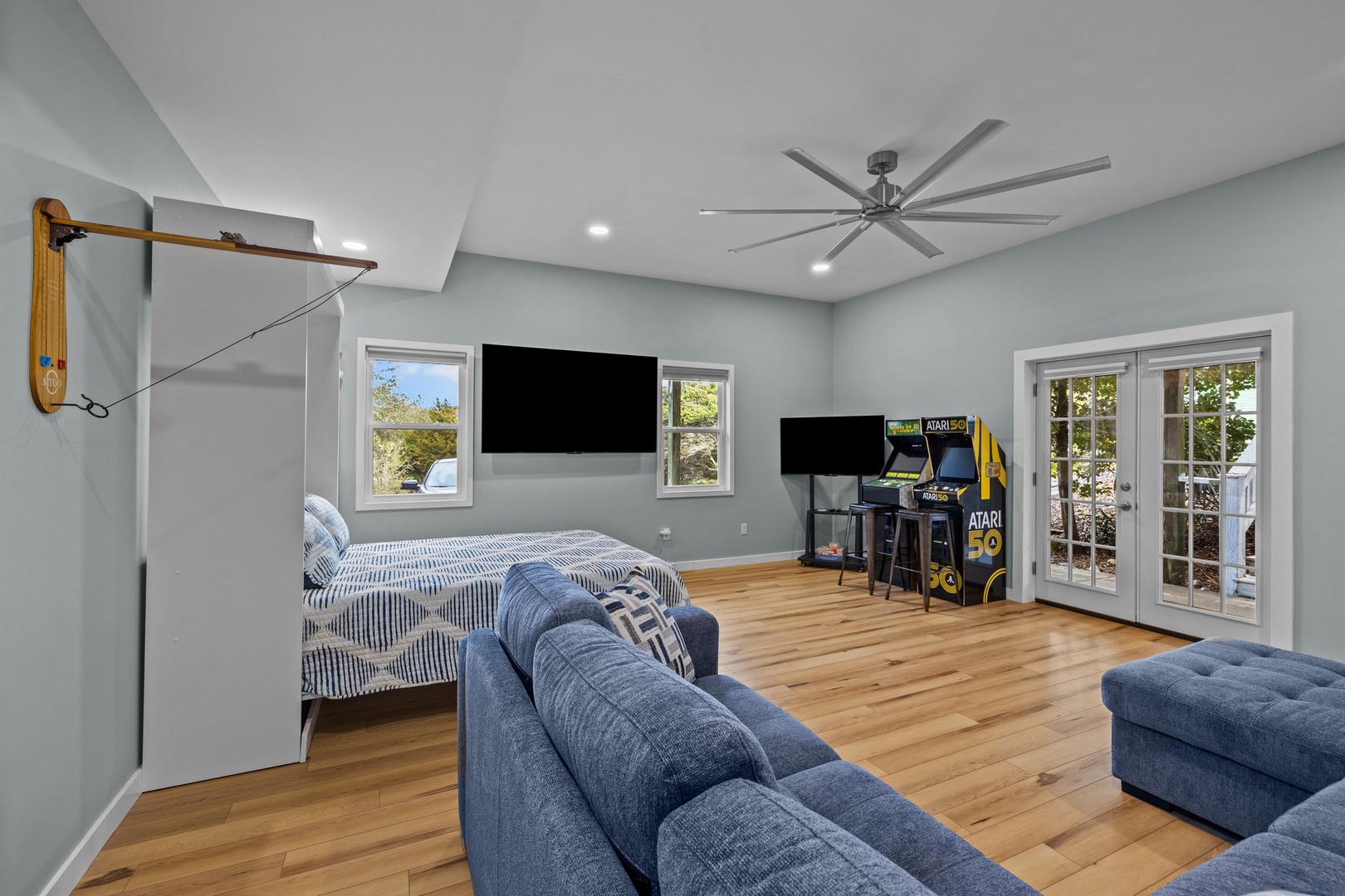 Your game room features arcade fun, comfy seating, and a murphy bed for extra guests - perfect for family entertainment.