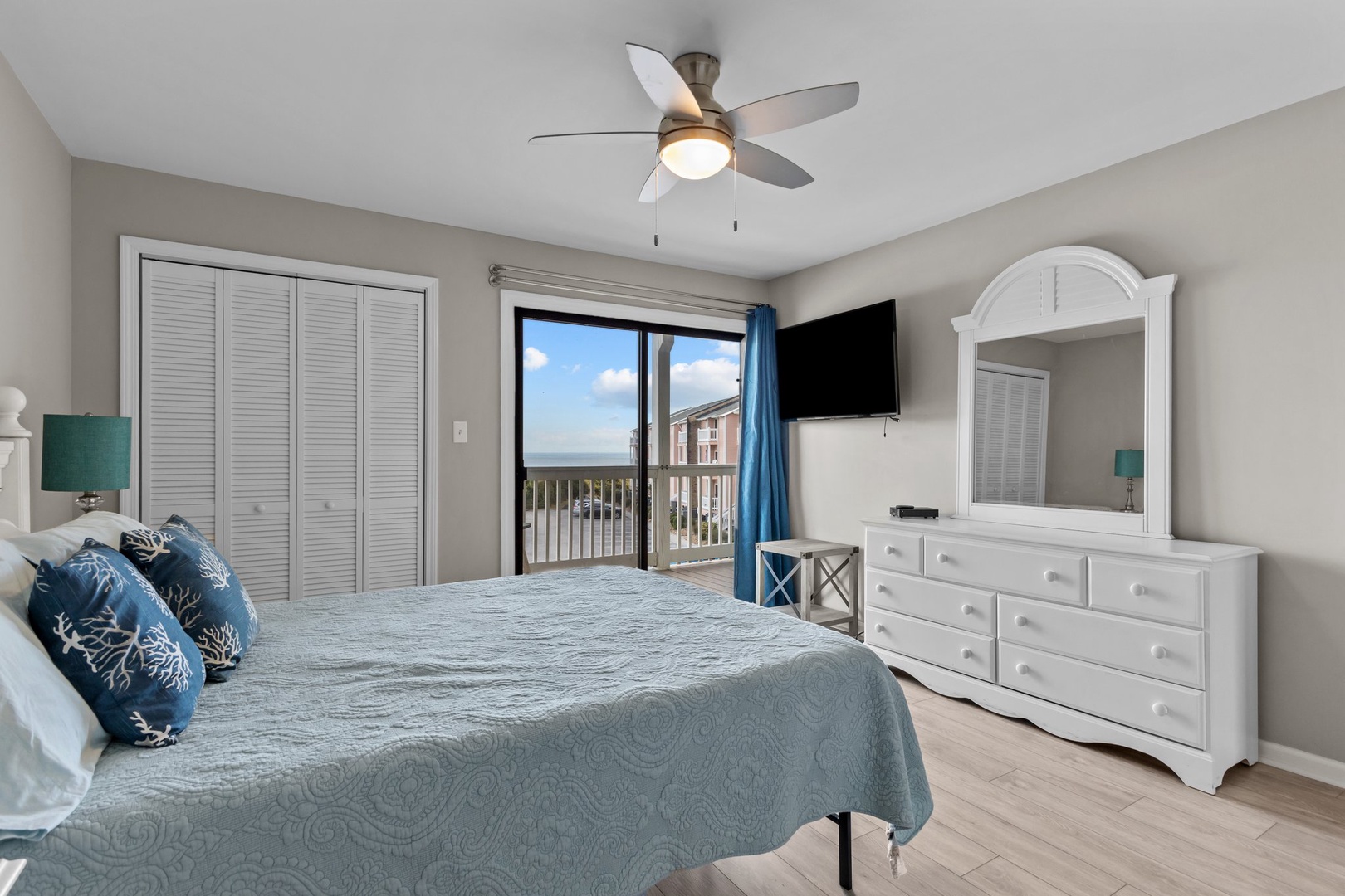 Wake up to ocean breezes in your coastal bedroom, complete with a ceiling fan for comfort and flat-screen TV for relaxing evenings.