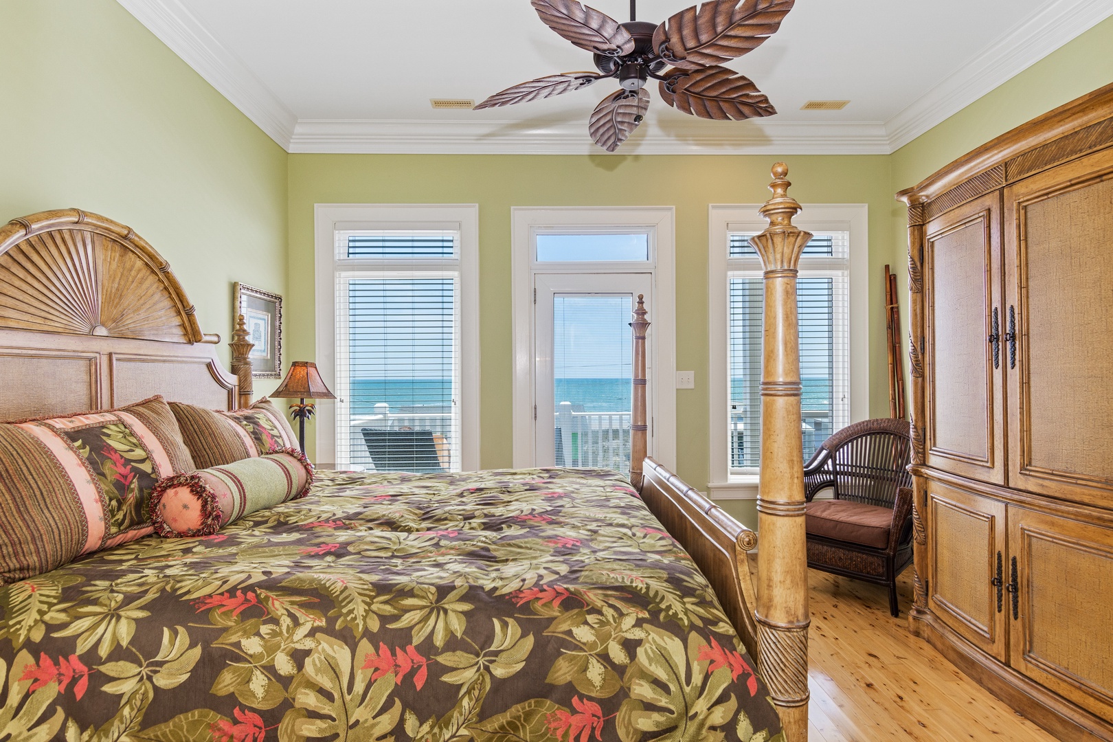 Wake up to breathtaking ocean views from your tropical-inspired bedroom, where tropical decor meets beachfront luxury.