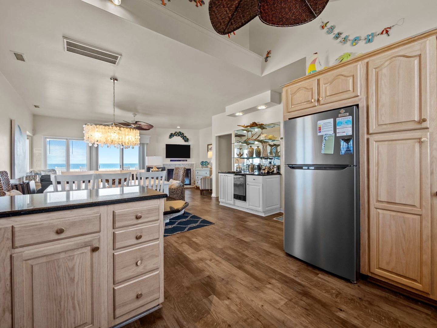 You'll love creating beach memories in this open kitchen with ocean views and coastal decor inspiring your coastal getaway.
