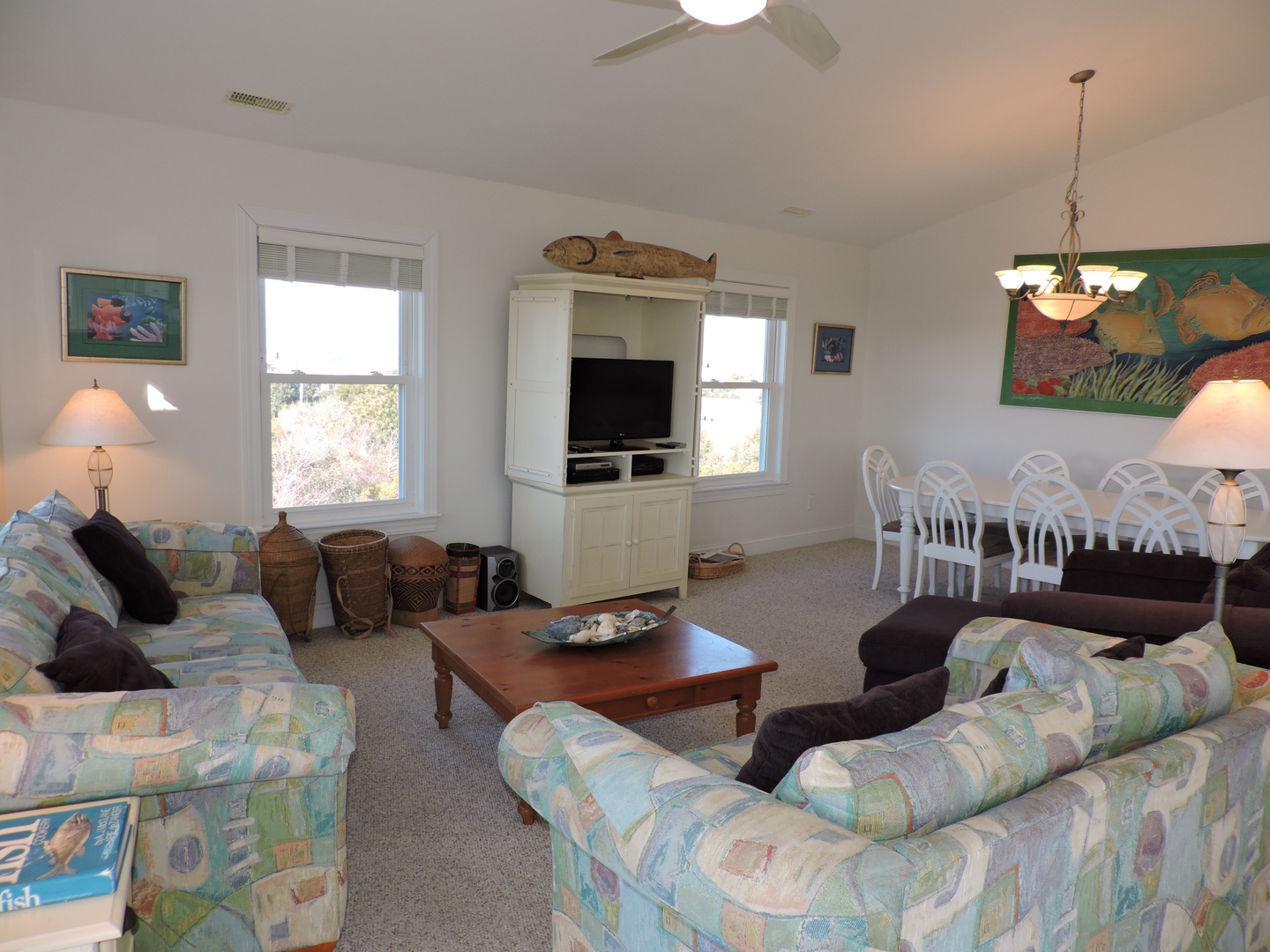 Relax in your spacious living area with comfy seating, entertainment center, and bright dining space perfect for family gatherings.