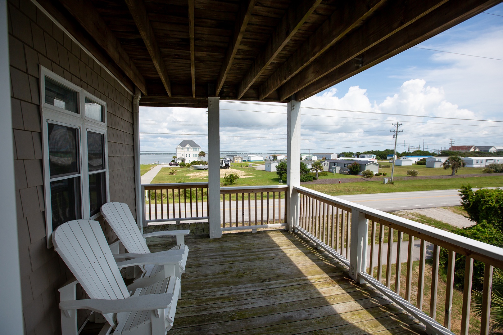 Relax in your private Adirondack chairs on this covered porch, where you can sip morning coffee while taking in peaceful neighborhood views.