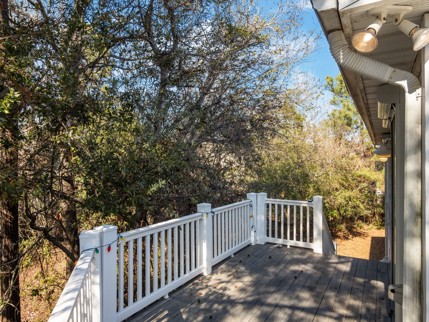 Step onto your private deck surrounded by mature trees for peaceful morning coffee or evening relaxation in this secluded natural setting.