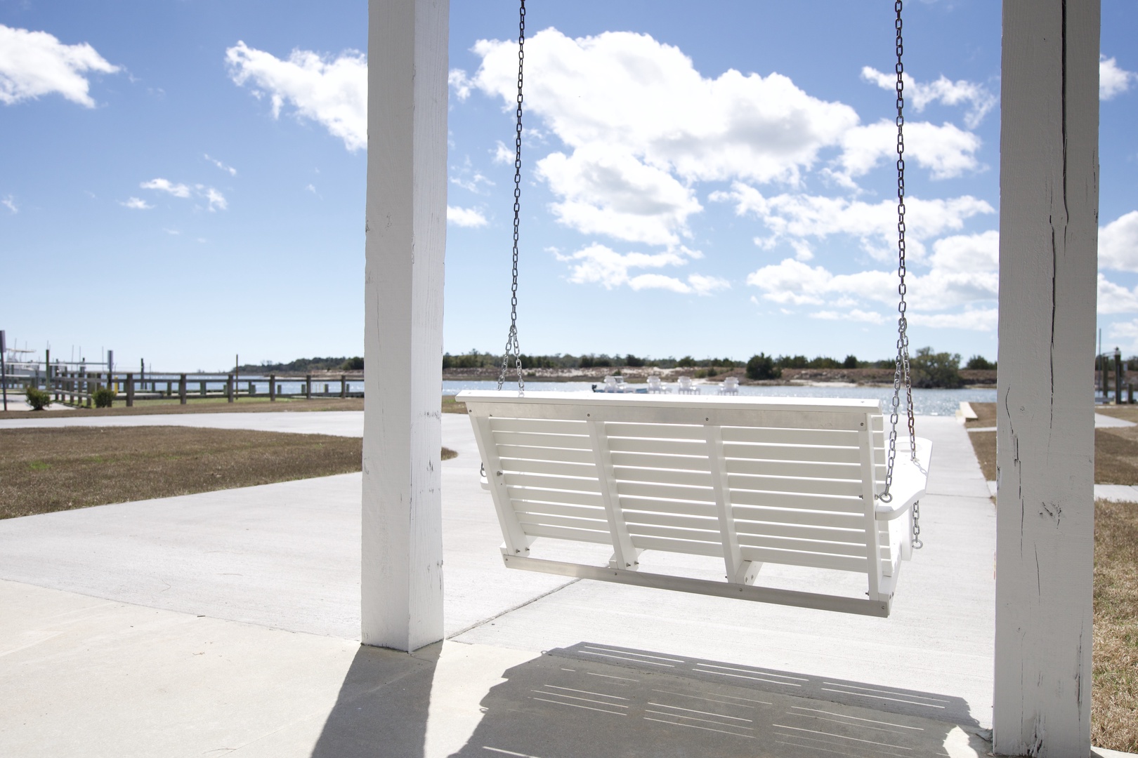 Swing gently on your private porch swing while taking in peaceful water views and endless blue skies.