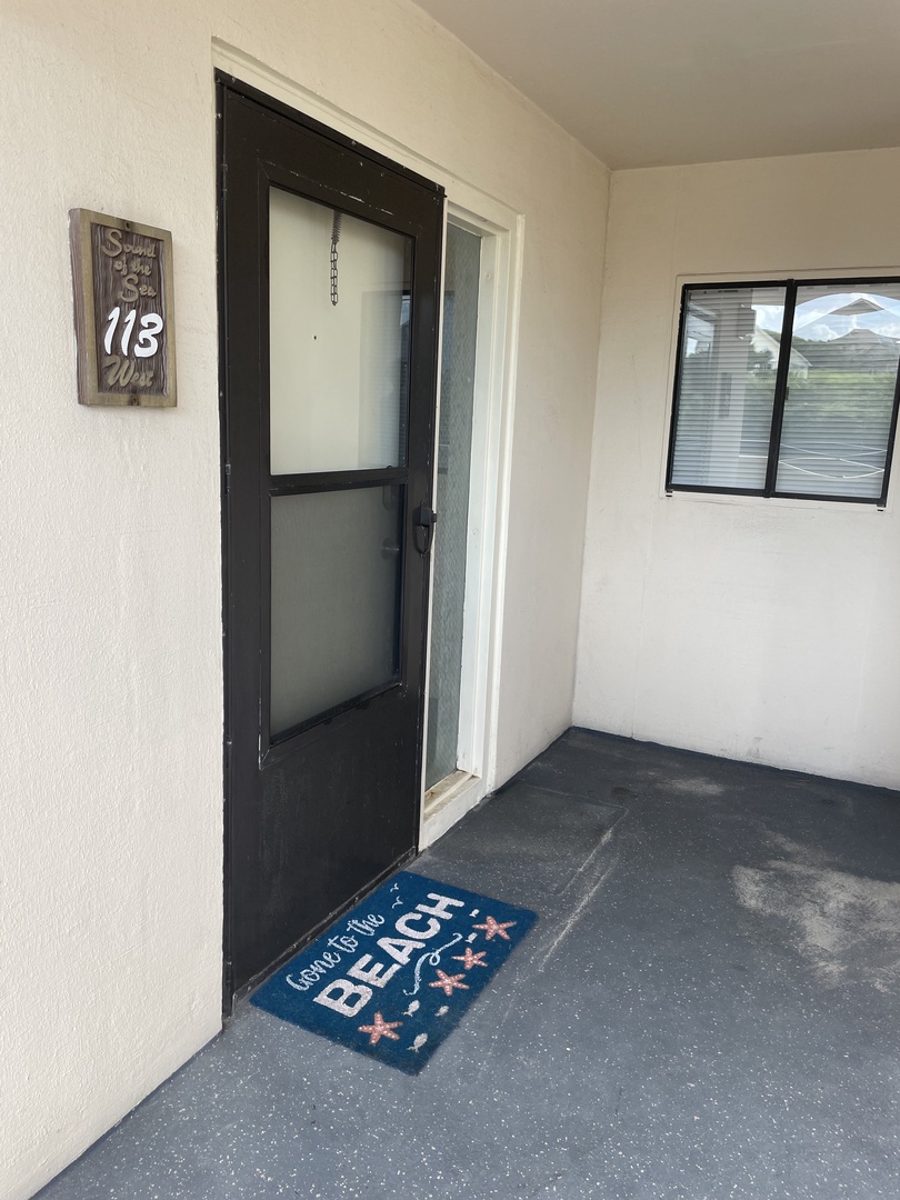Step into your private entrance with a welcoming beach sign that sets the vacation mood from the moment you arrive.