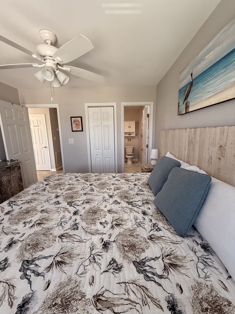 Unwind in this cozy bedroom, where coastal artwork above the bed and soft linens invite you to sink in and feel completely at home.