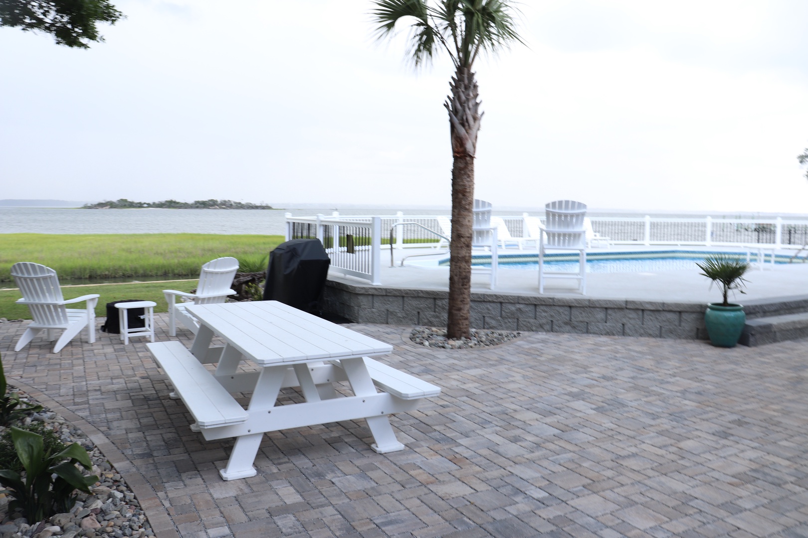 Picture yourself dining al fresco at your private picnic table, then cooling off in your sparkling pool while gazing at serene water views.