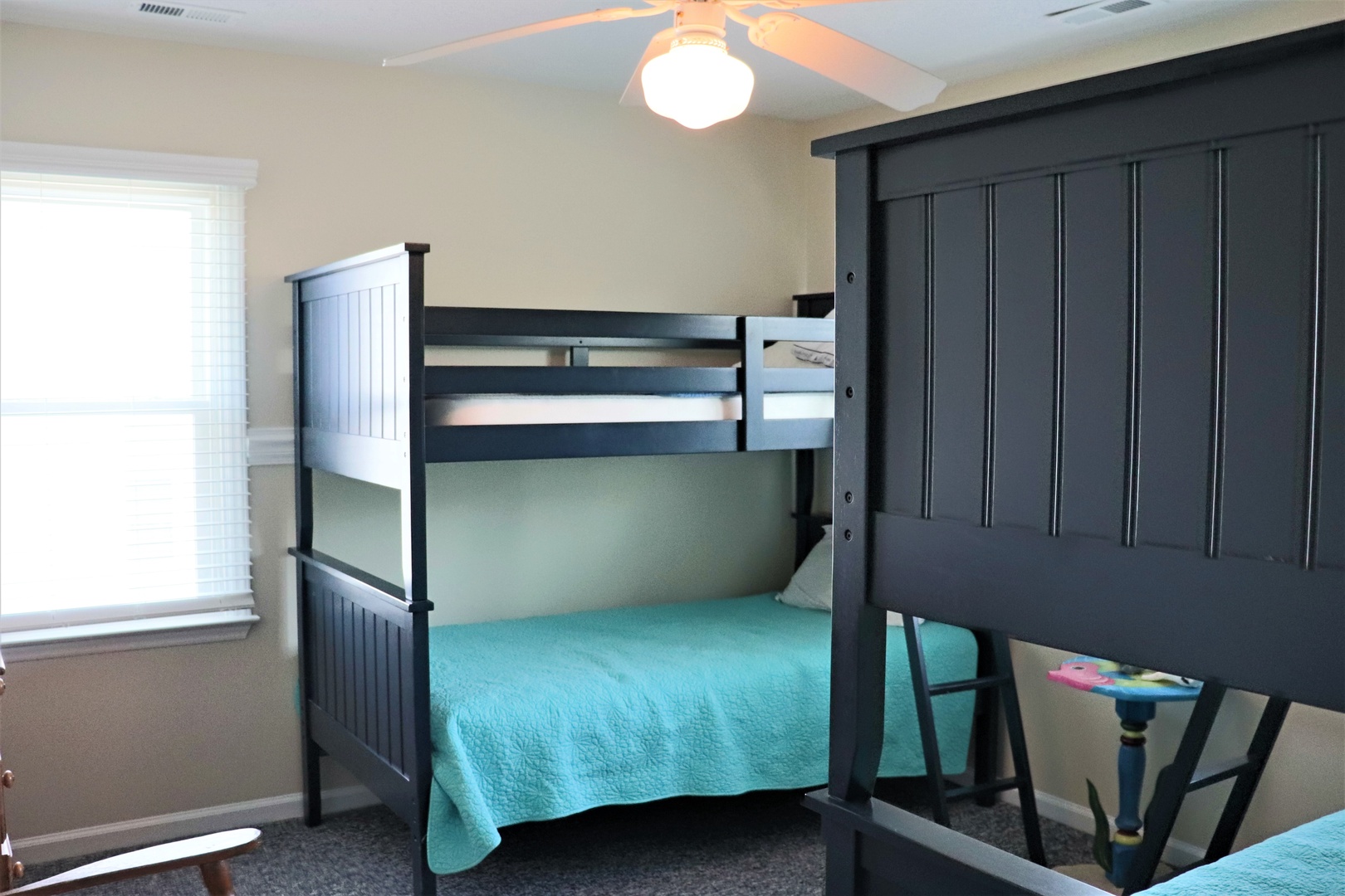 Your little adventurers will love bunking together in this cozy bedroom with sturdy bunk beds and plenty of space to play.