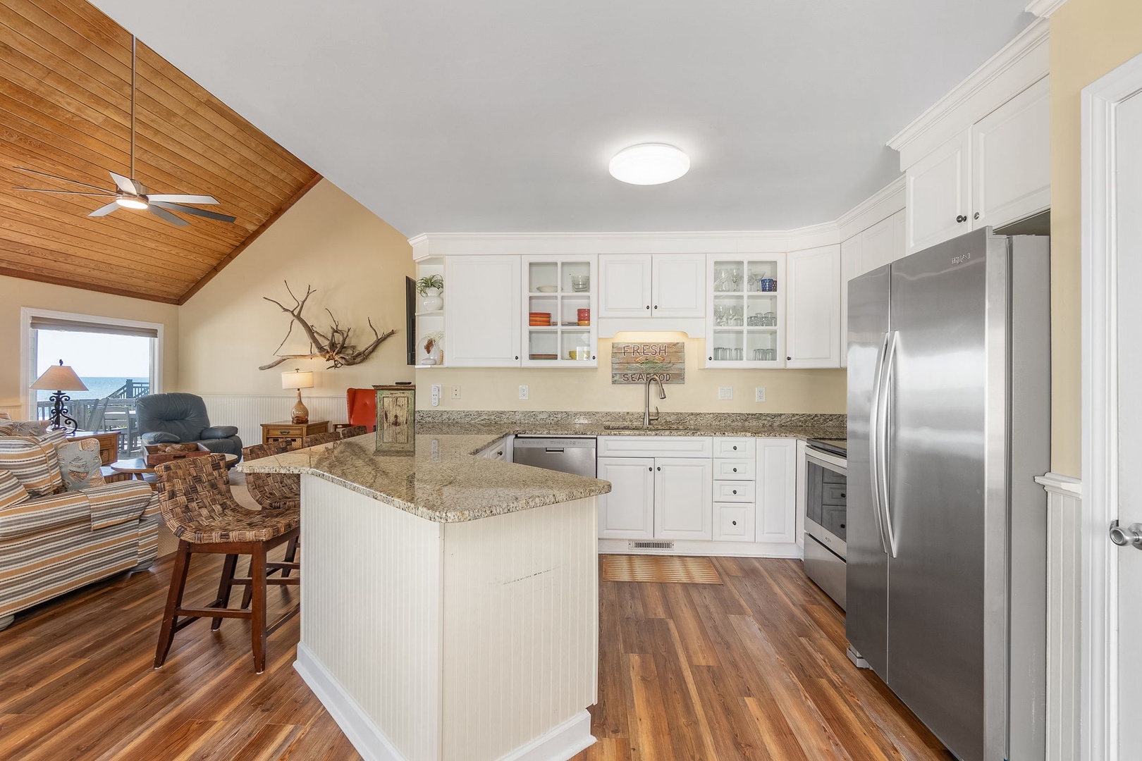 Your gourmet kitchen awaits with granite countertops, stainless steel appliances, and an island perfect for morning coffee or preparing fresh meals.