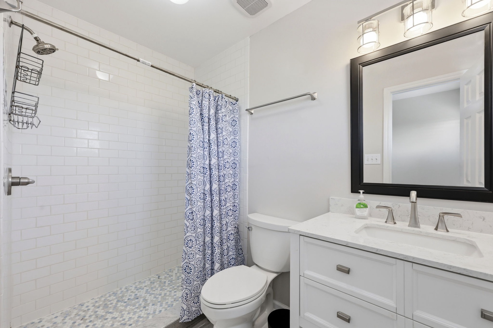 Step out of your shower feeling refreshed on charming mosaic tile floors. Clean lines and modern fixtures create your personal retreat after exploring the area.