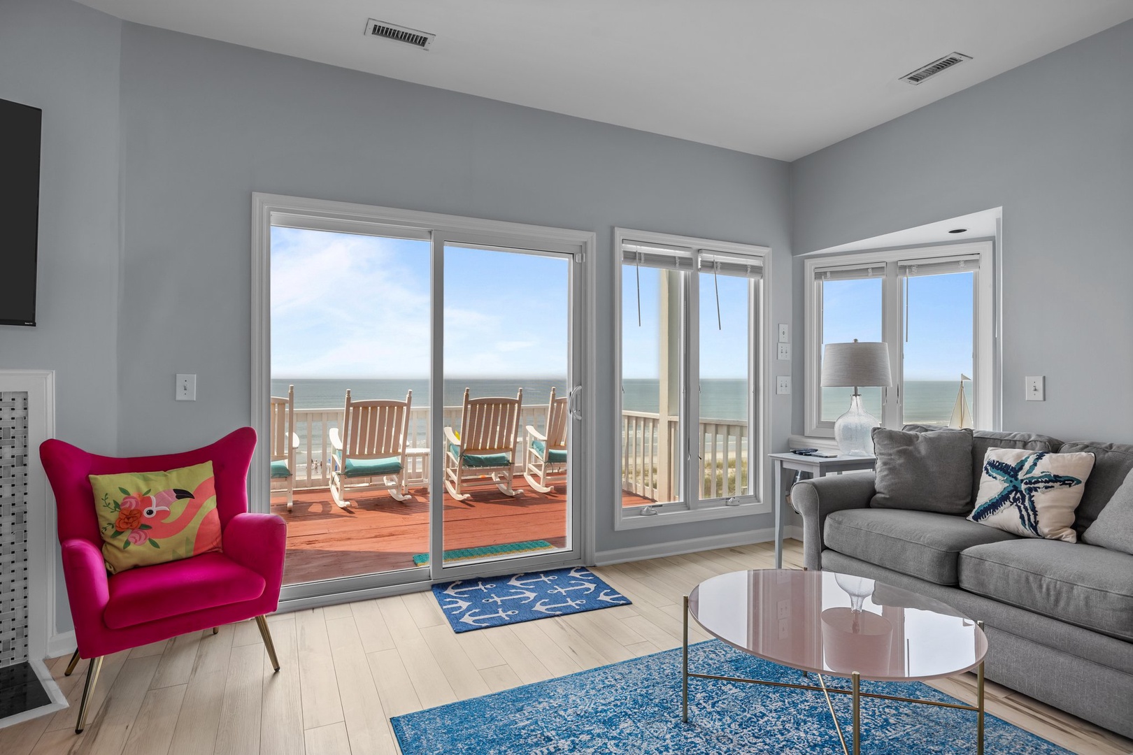 Relax in your bright living room where ocean breezes flow through sliding doors to your private deck with stunning sea views.