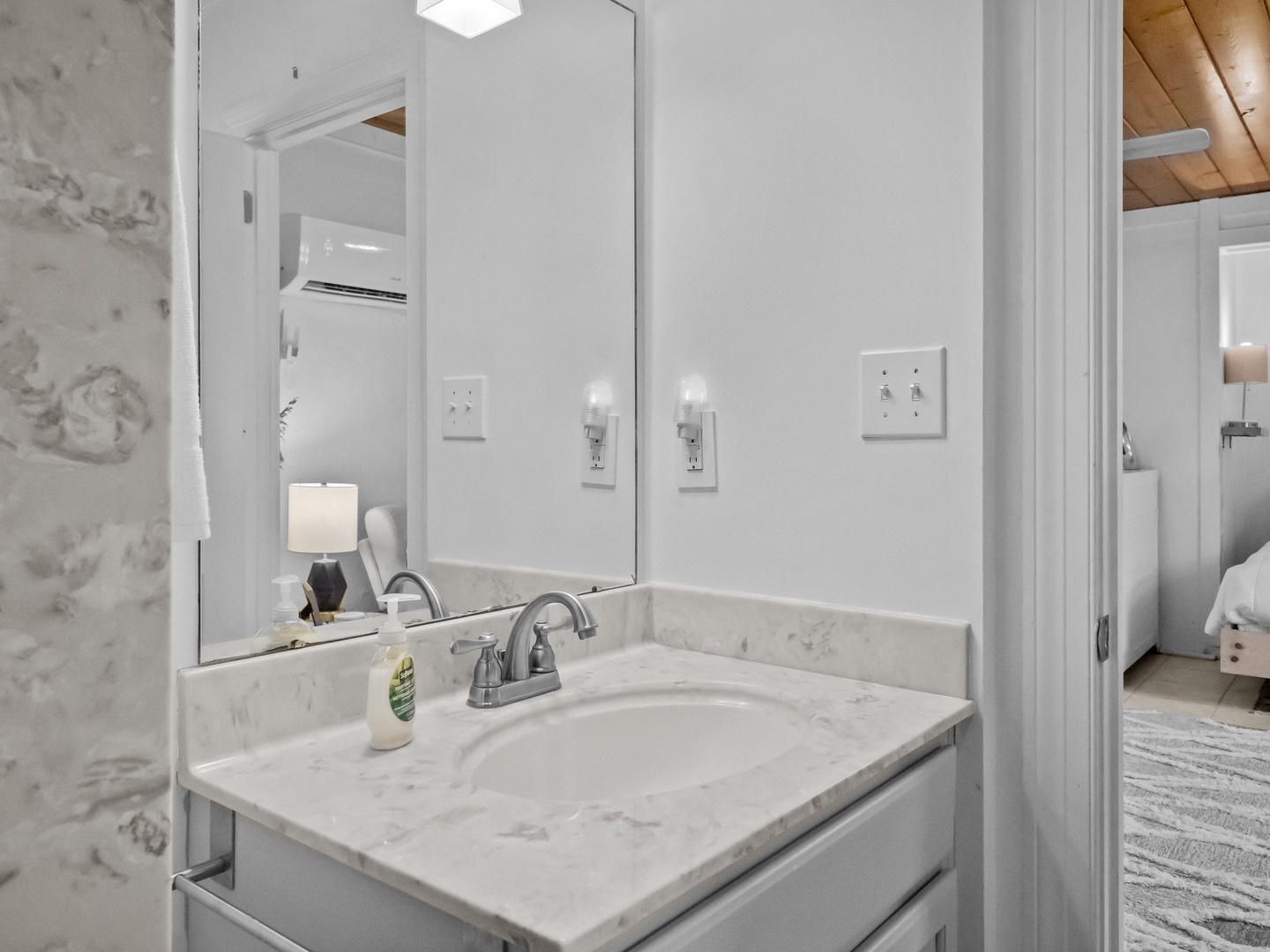 Step into your pristine marble bathroom featuring elegant countertops and modern fixtures for your daily refreshment routine.