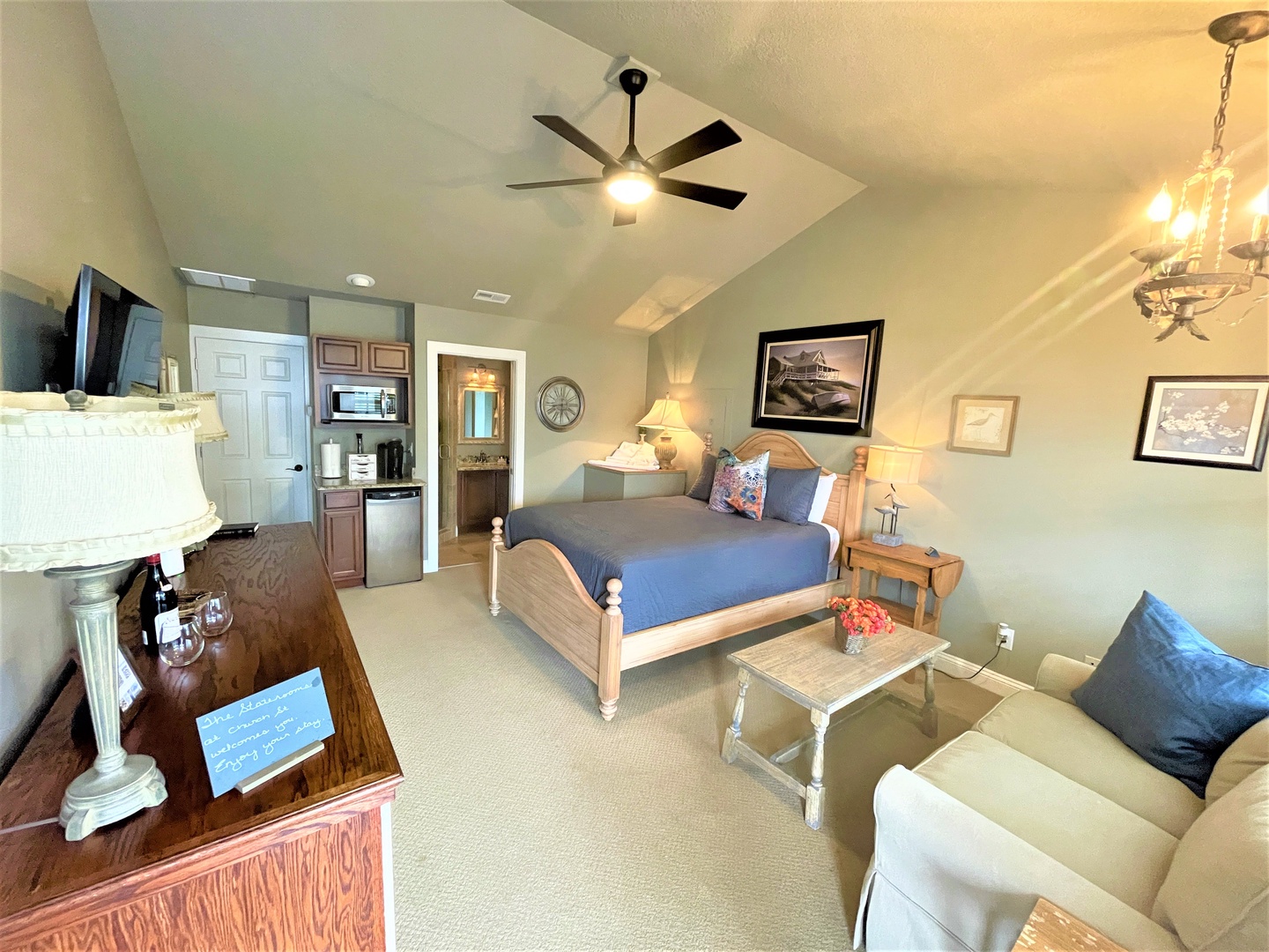 Your spacious studio offers everything you need - comfortable bed, cozy seating, full kitchenette, and thoughtful coastal touches for a perfect getaway.