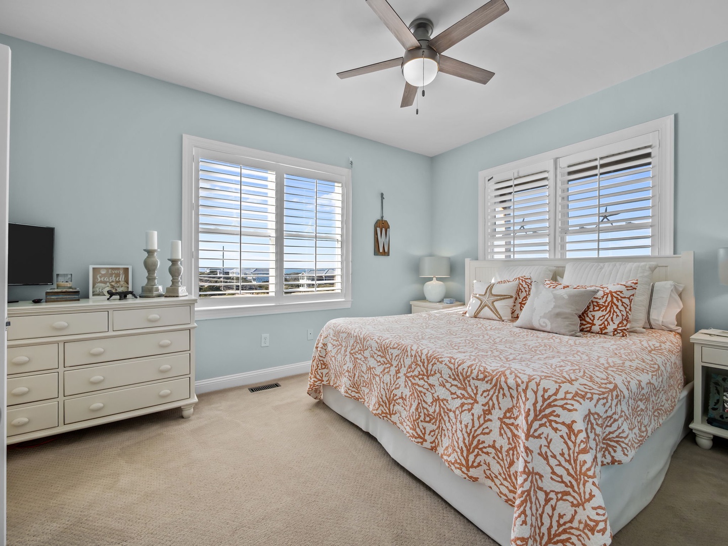 Wake up in your serene coastal bedroom with soft sea-glass walls and ocean-inspired décor creating the perfect retreat.