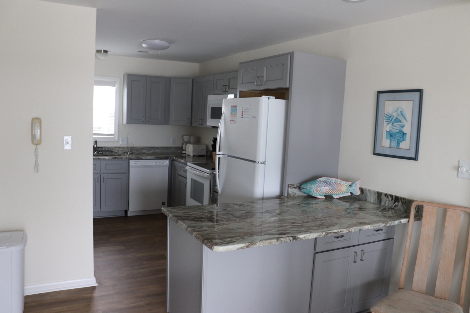 Your modern kitchen features granite countertops, full appliances, and bright open layout for preparing meals together.