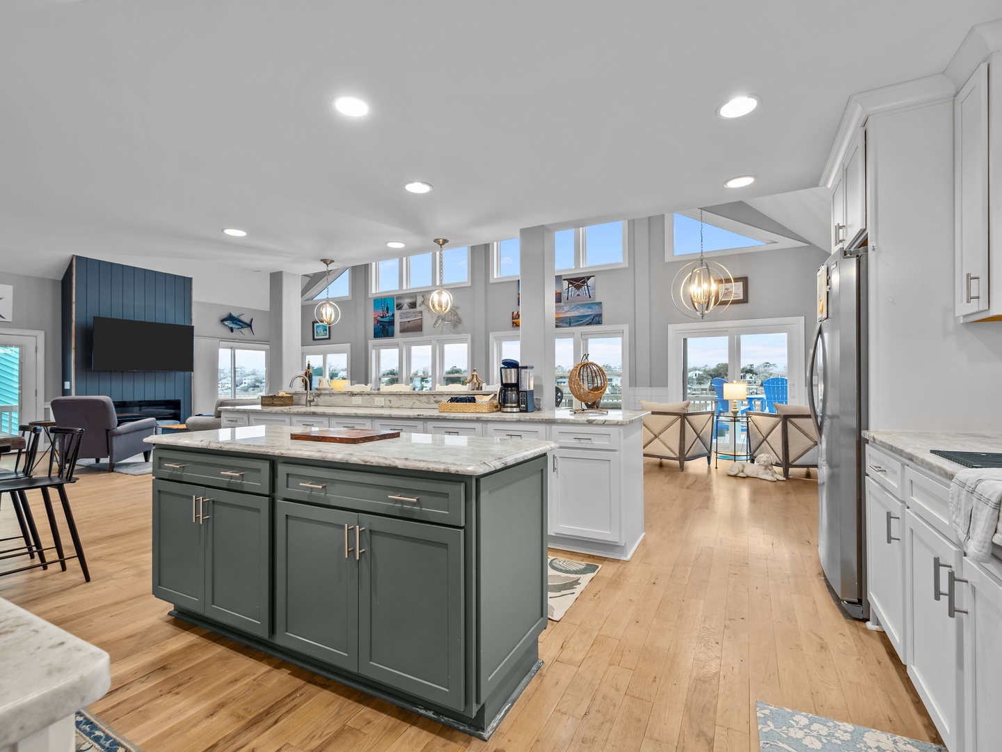 Your gourmet kitchen features granite countertops, stainless steel appliances, and soaring ceilings with natural light streaming through skylights—perfect for cooking memorable meals.