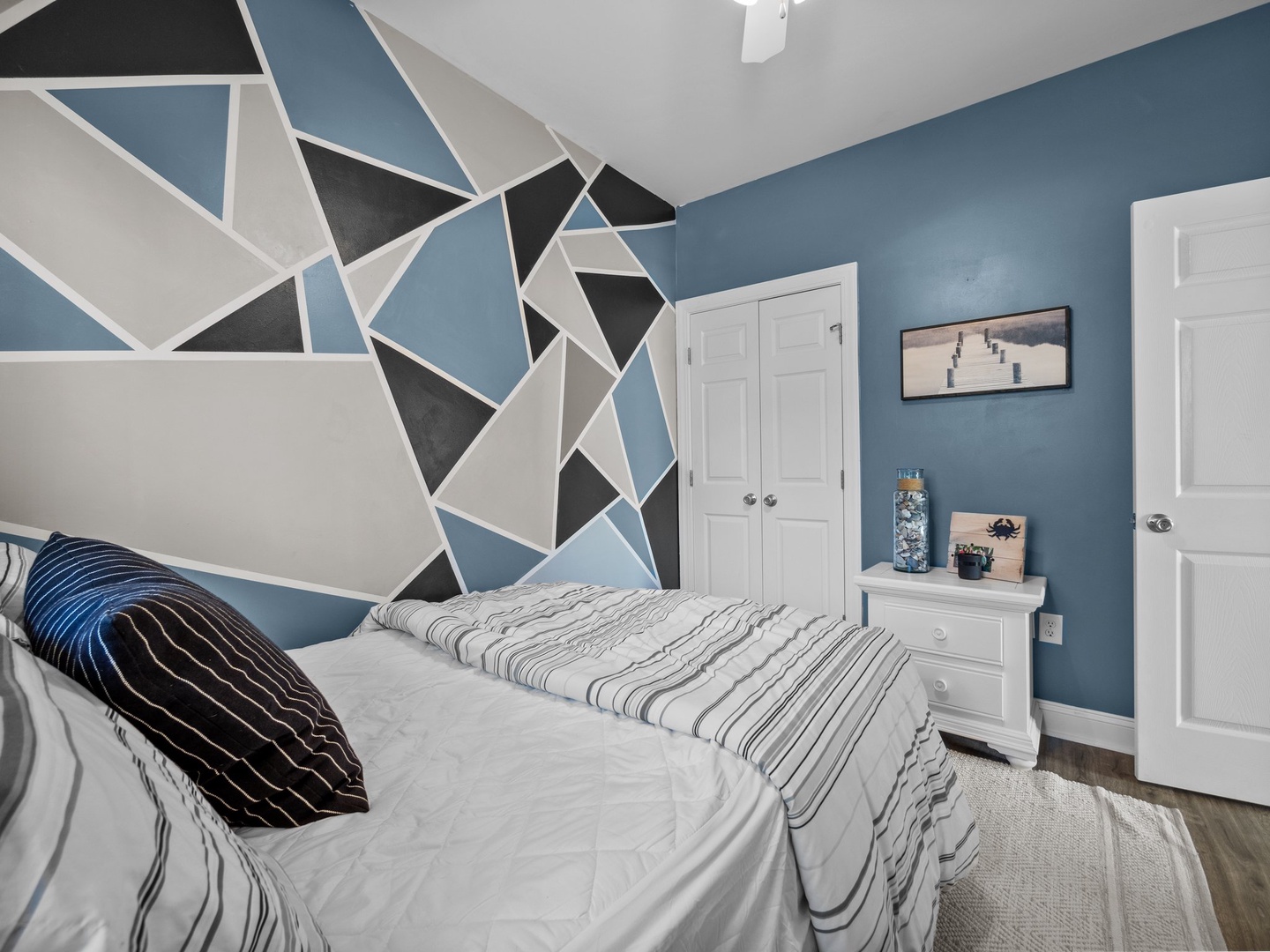 Sleep soundly in your stylish retreat with stunning geometric wall art and modern comfort touches.