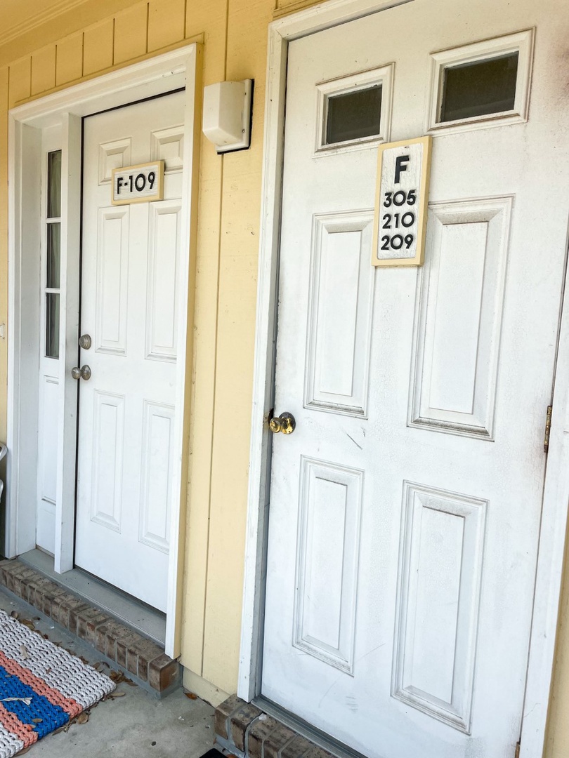 Property entrance with clearly marked unit numbers for easy identification upon arrival.