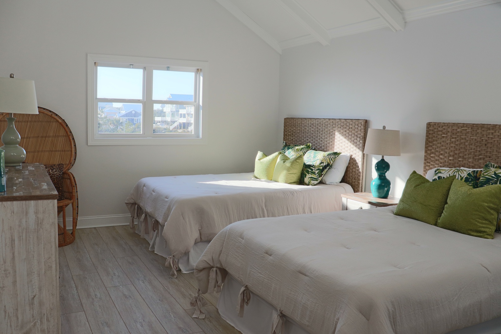Drift off peacefully in your coastal retreat with twin beds, tropical accents, and gentle ocean breezes through the window.