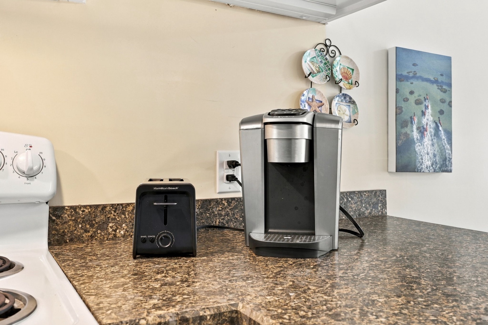Start your mornings right with a coffee maker and toaster on the granite counter, ready whenever you need them.