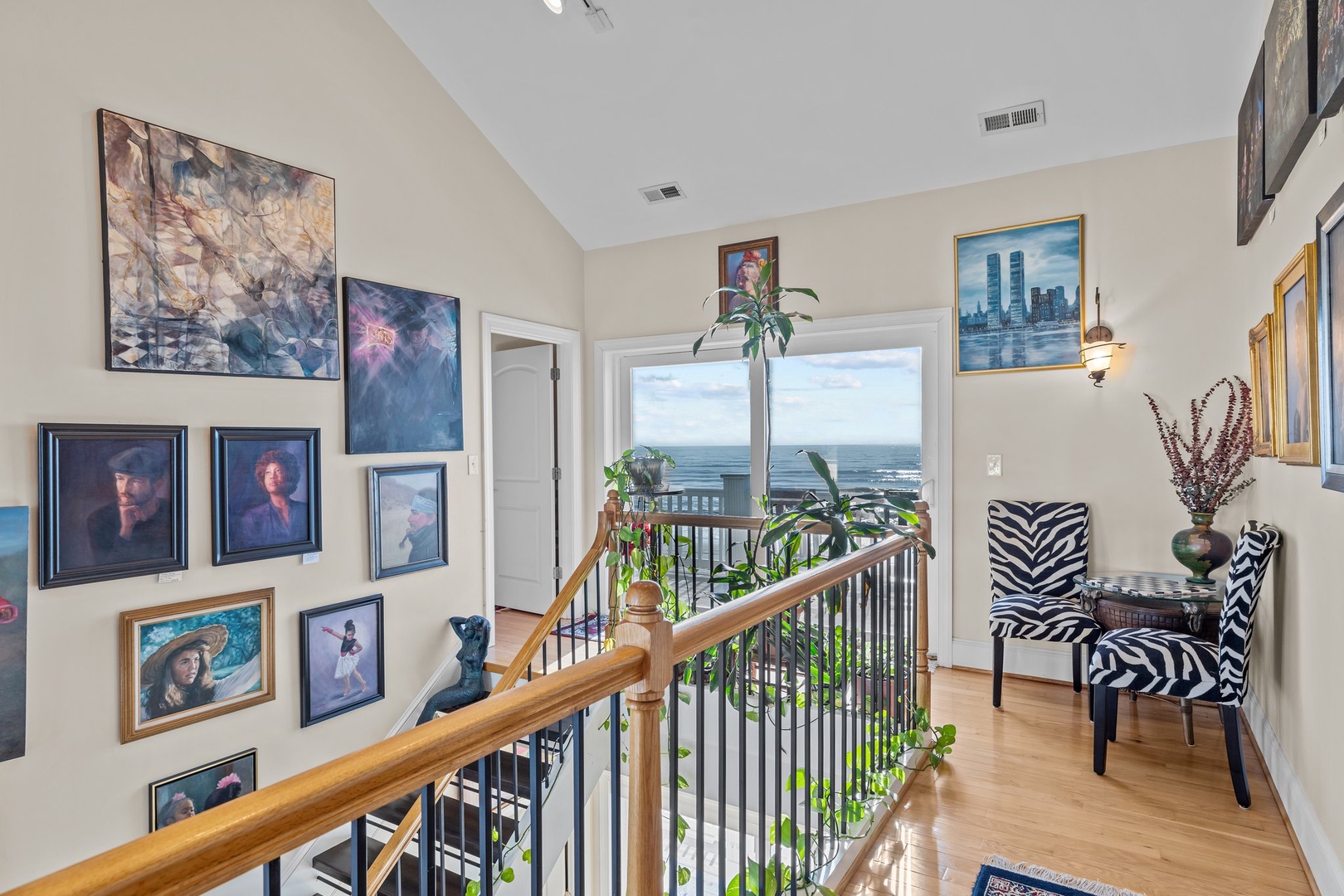 Admire ocean views from your private art-filled hallway, where zebra-striped seating creates the perfect spot to savor morning coffee.