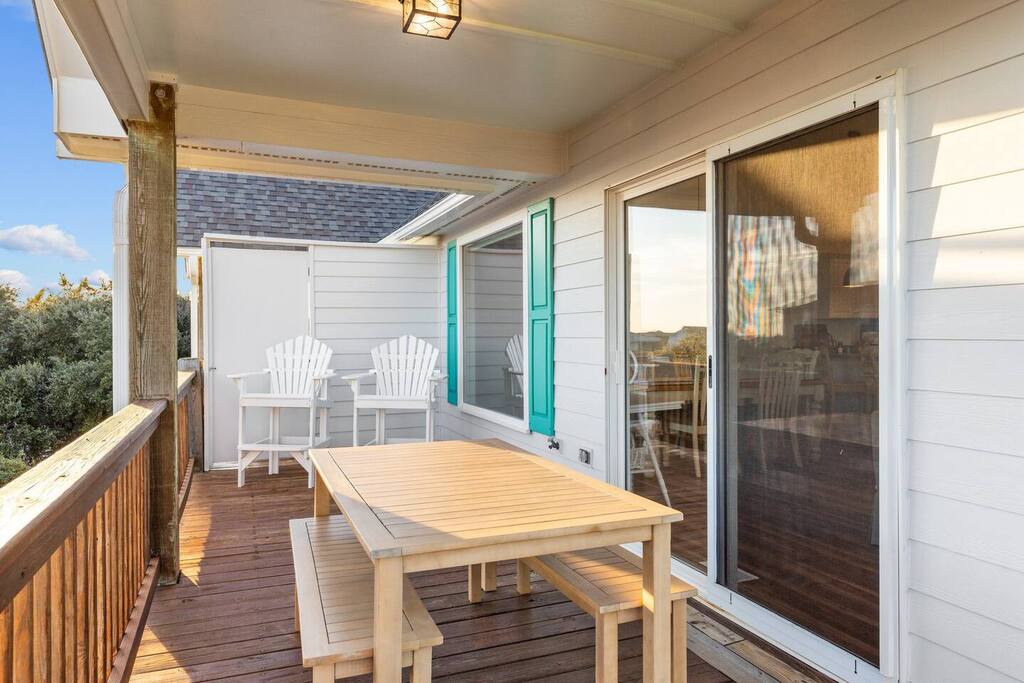 Step onto your private deck where morning coffee tastes better at the wooden table, and Adirondack chairs invite you to unwind.