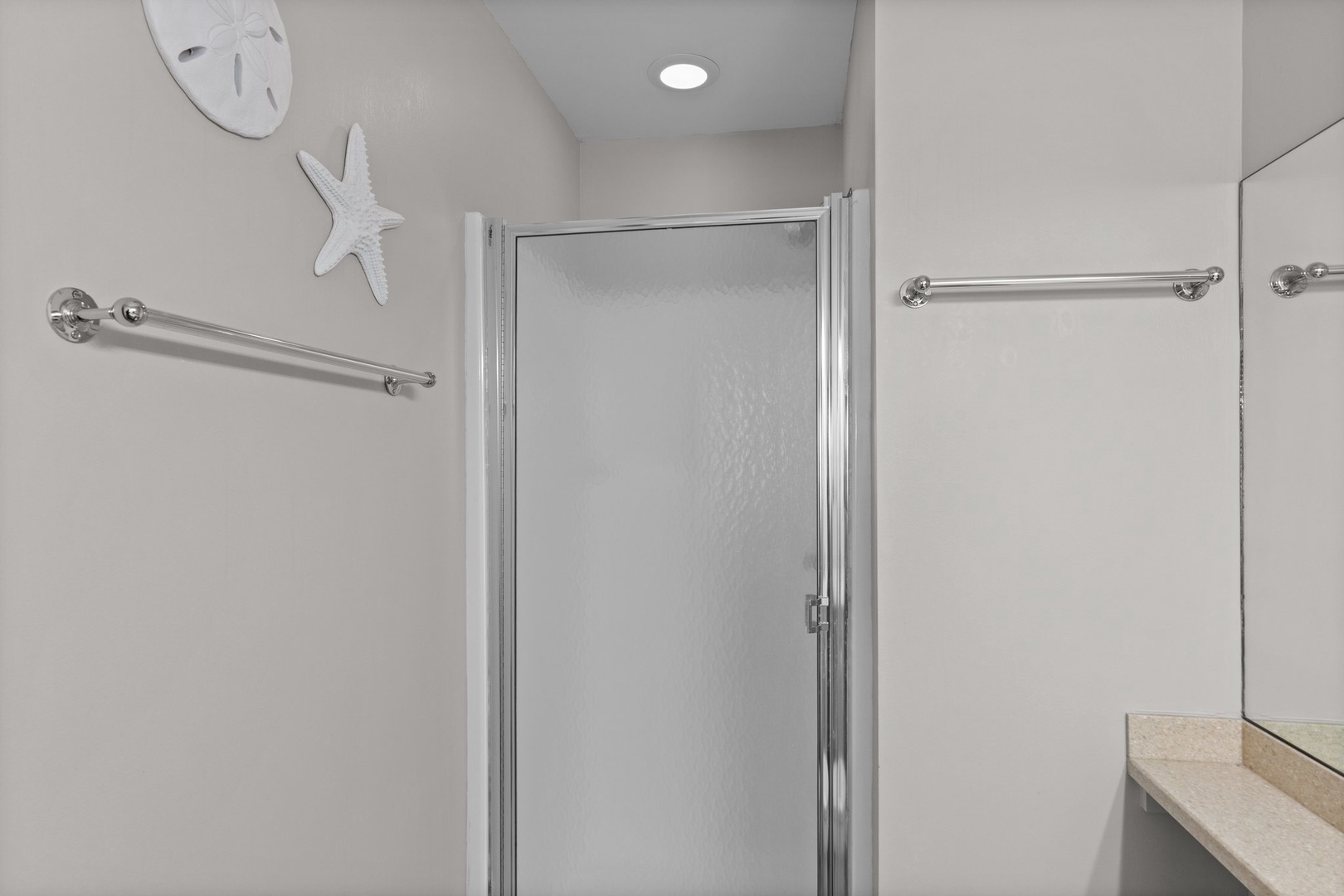 Your private bathroom features accessible grab bars and a spacious walk-in shower for your comfort and safety.