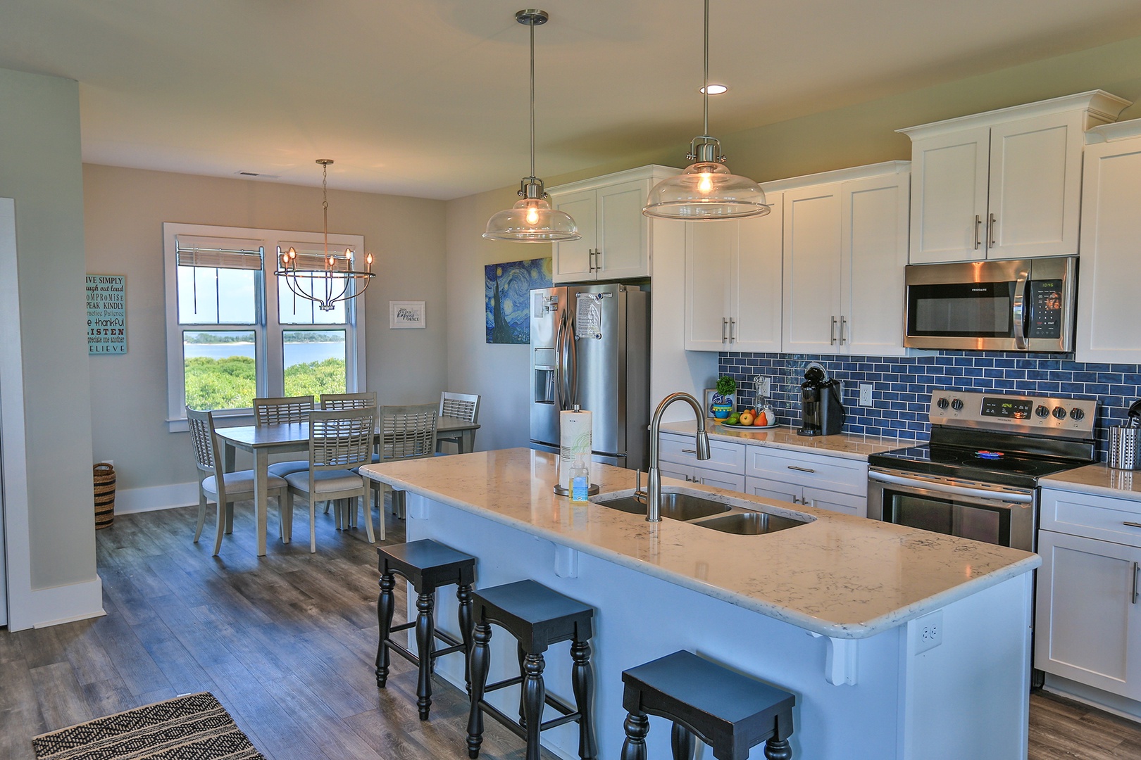 Your dream kitchen awaits with marble countertops, modern appliances, and a gorgeous view. Cook while enjoying nature's beauty through expansive windows.