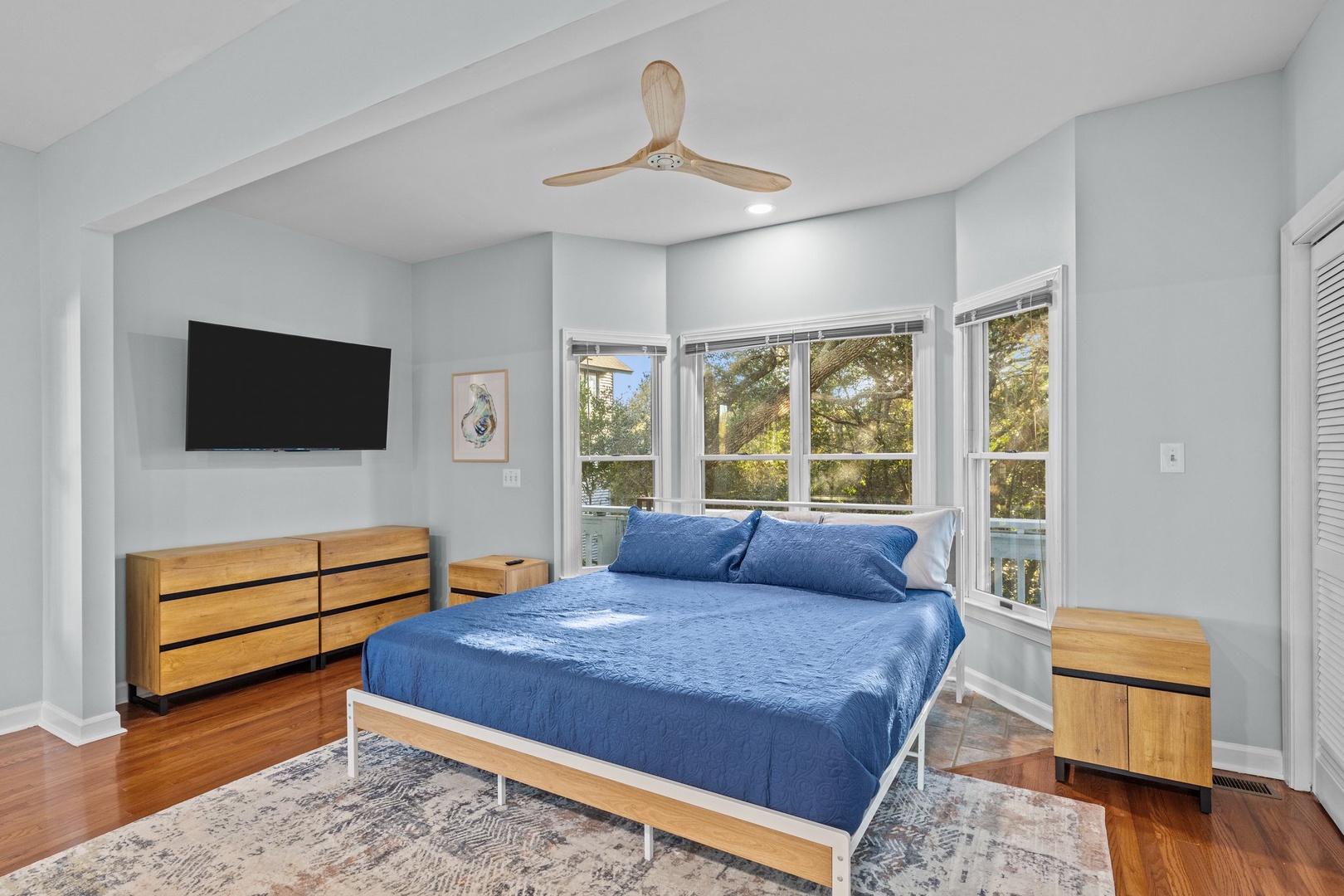 Unwind in your bright bedroom with garden views, exposed beams, and modern comfort for peaceful sleep.