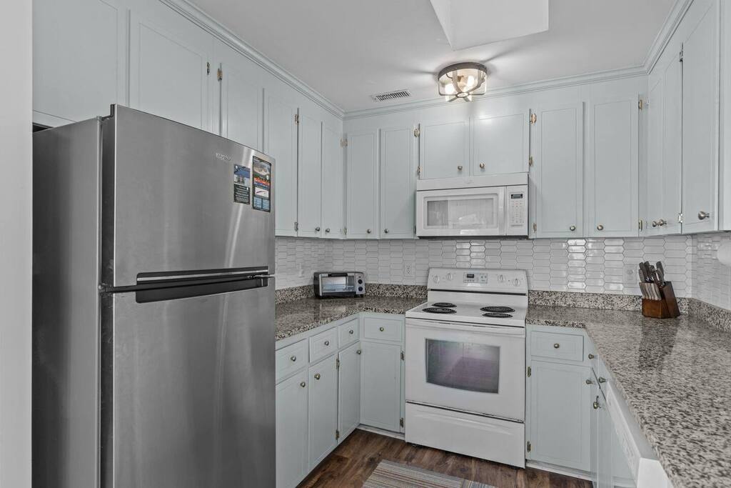 Your fully equipped kitchen features stainless steel appliances, granite countertops, and everything you need to create delicious home-cooked meals during your stay.