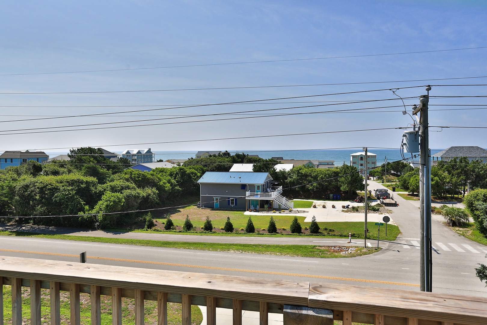 Ocean glimpses and coastal neighborhood views create a peaceful backdrop for your beach getaway.