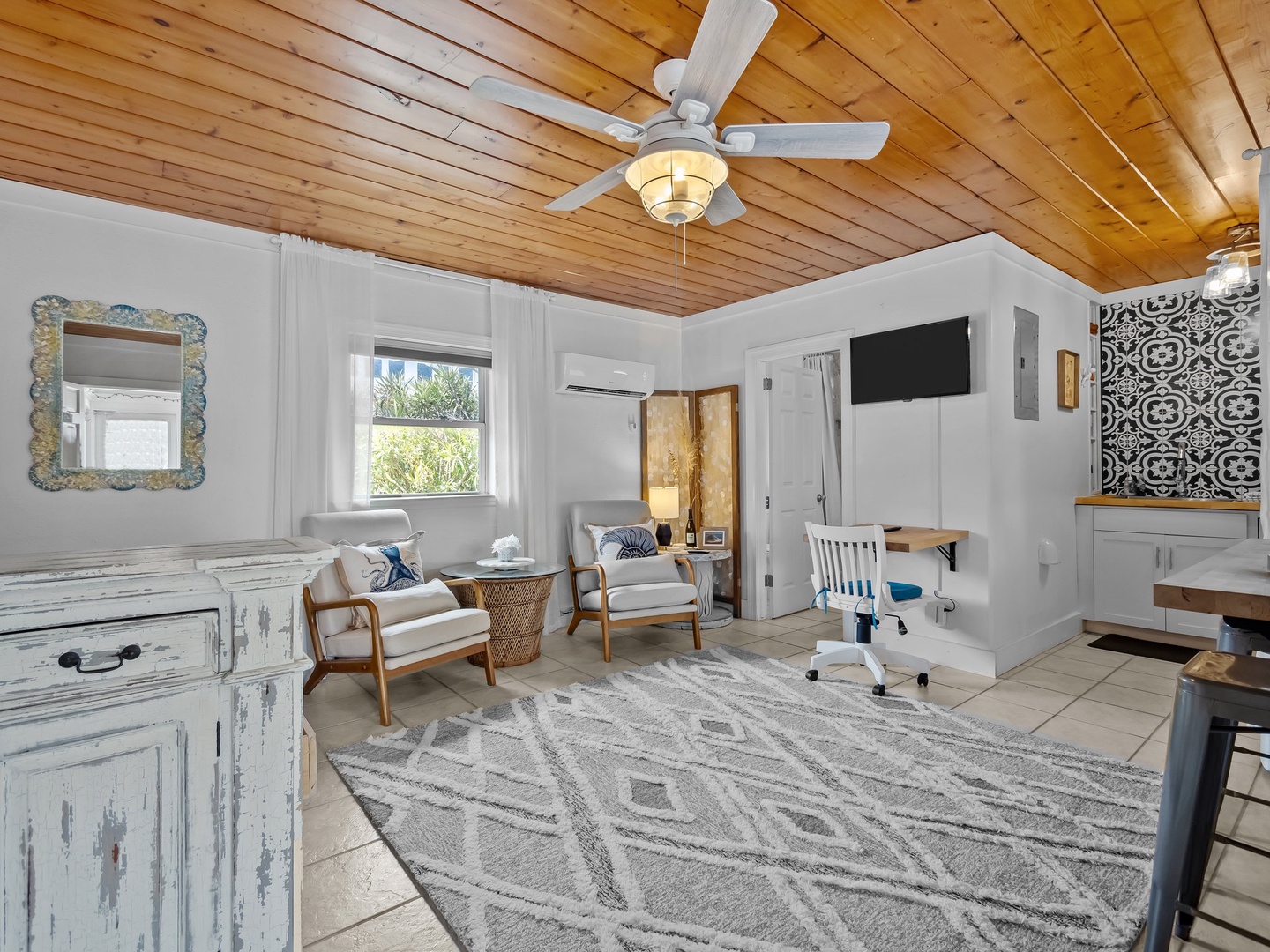 Your peaceful workspace features warm wood ceilings, coastal charm, and modern comfort for productive days.