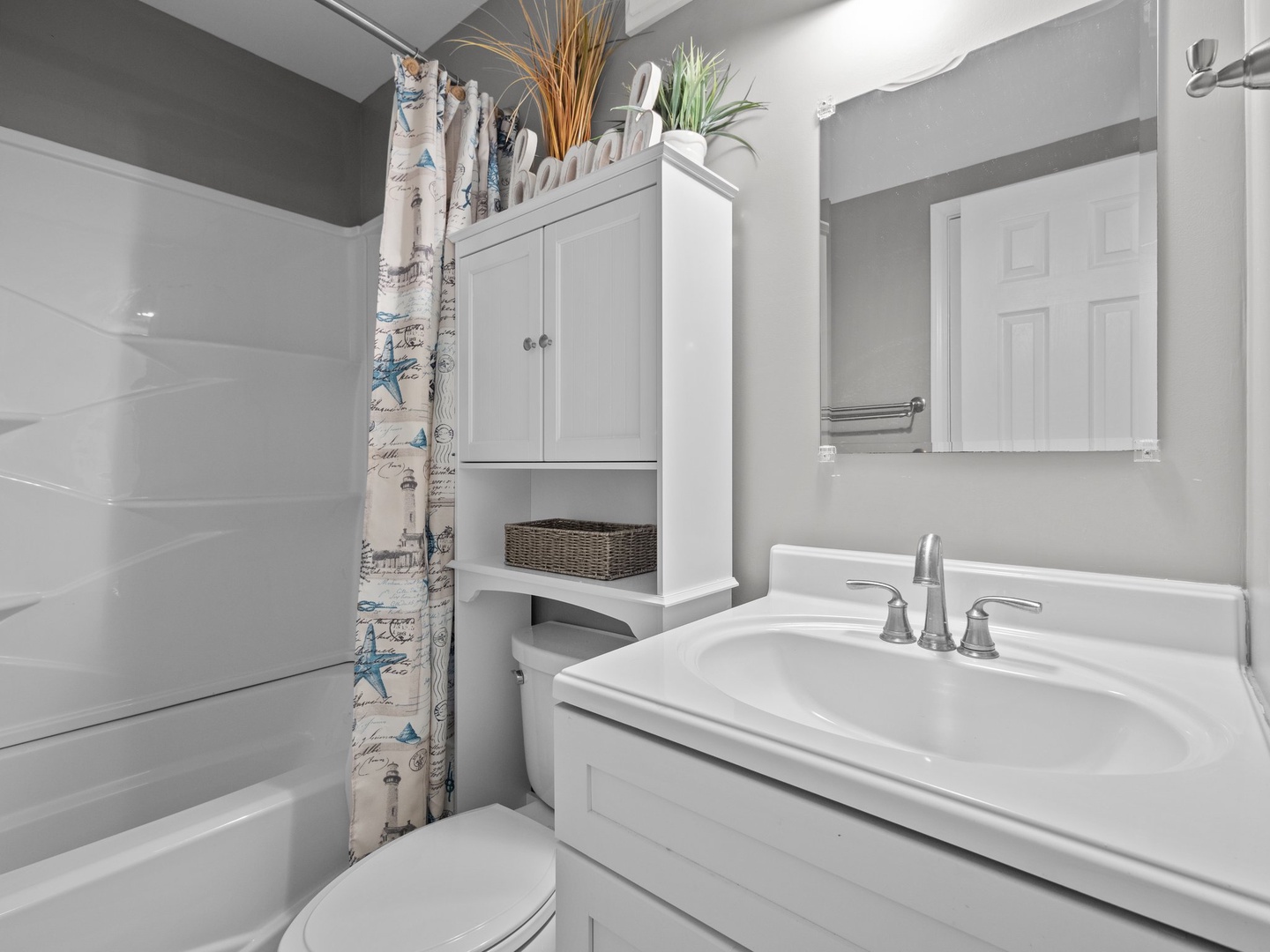 Step into your peaceful bathroom retreat with coastal touches and thoughtful storage, perfect for refreshing after beach days.