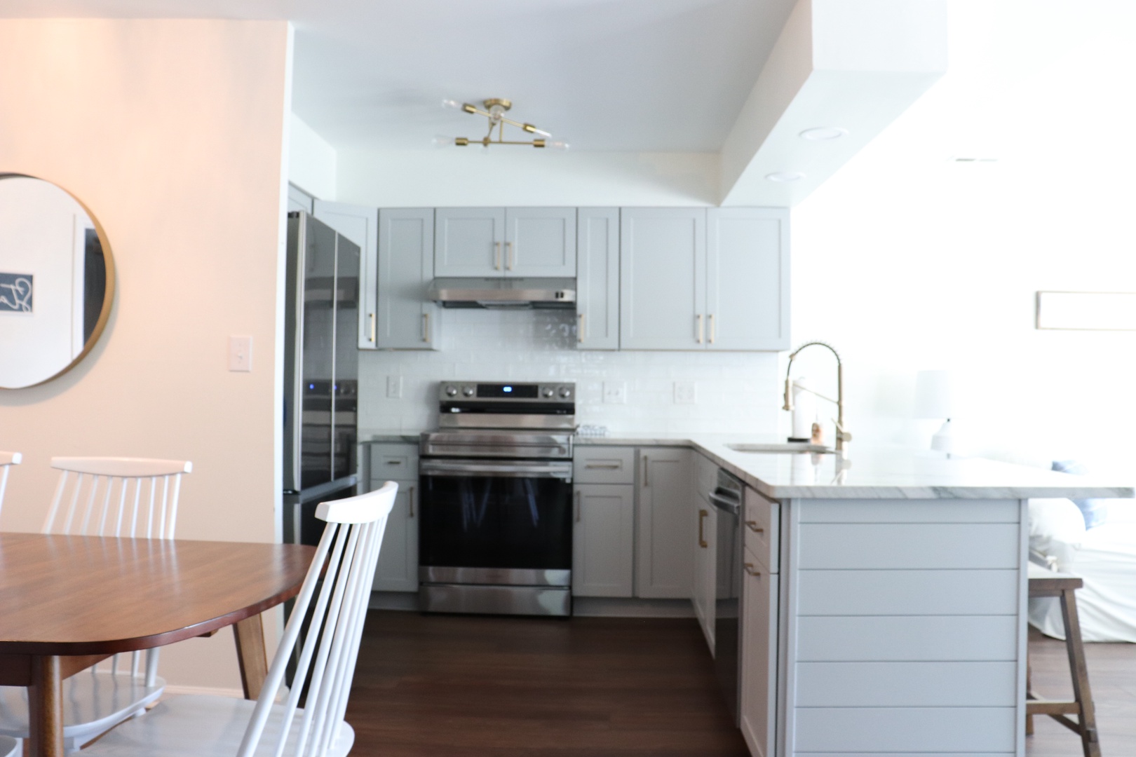 Your fully equipped kitchen awaits with modern appliances and marble countertops, perfect for preparing memorable meals during your stay.