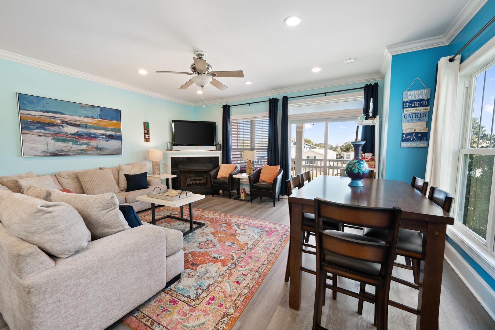Gather around your stylish dining table or sink into the plush sectional by your cozy fireplace in this vibrant open-concept space.