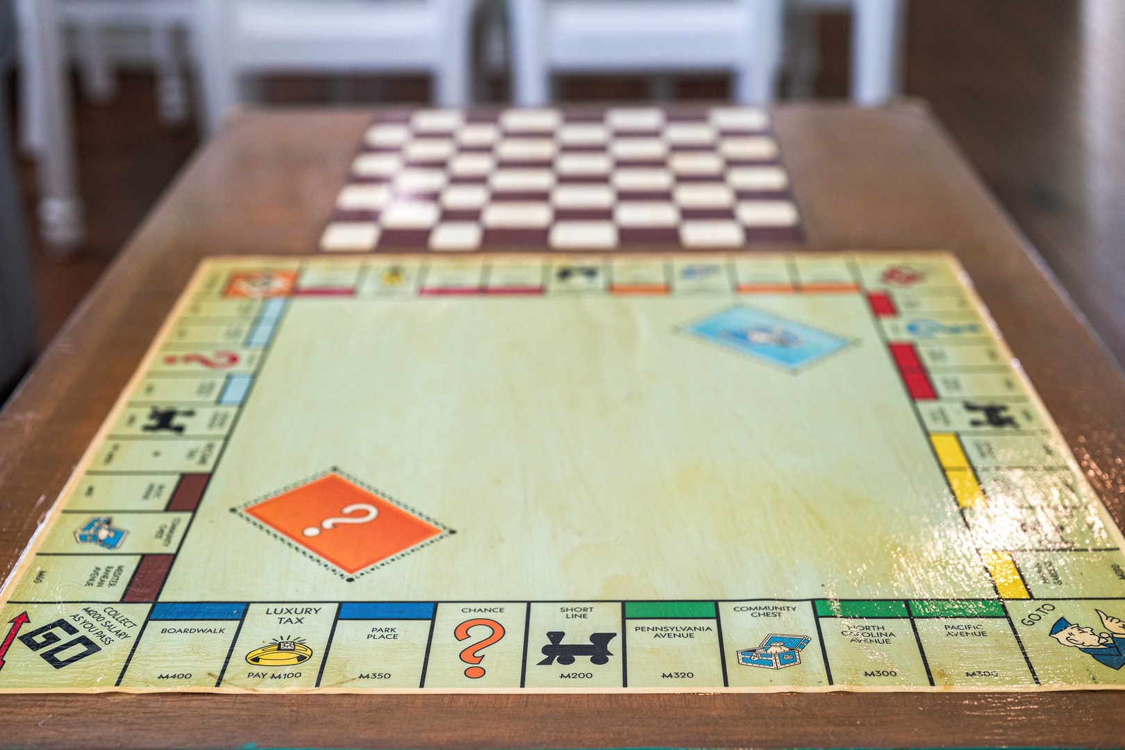 Challenge friends to classic board games at your cozy dining table, where memorable evenings unfold over friendly competition.