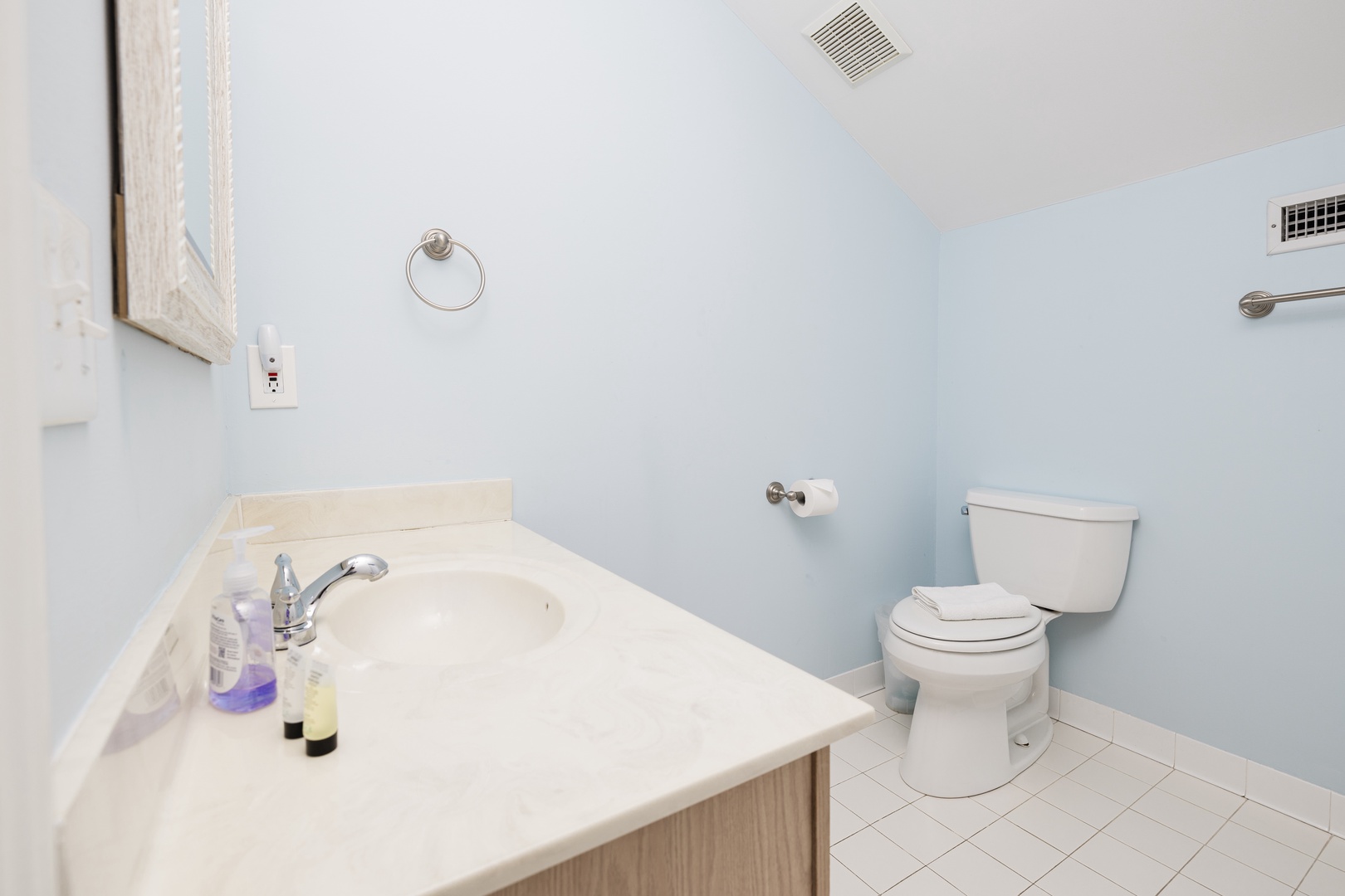 Fresh and clean bathroom with spacious vanity and modern fixtures for your comfort.
