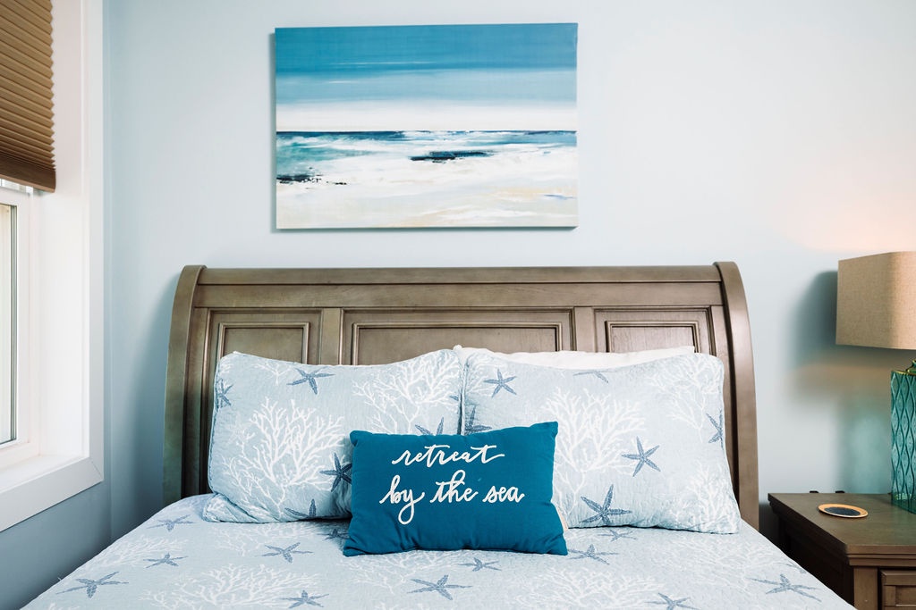 Drift into peaceful dreams surrounded by coastal charm and ocean-inspired décor that whispers of seaside serenity.