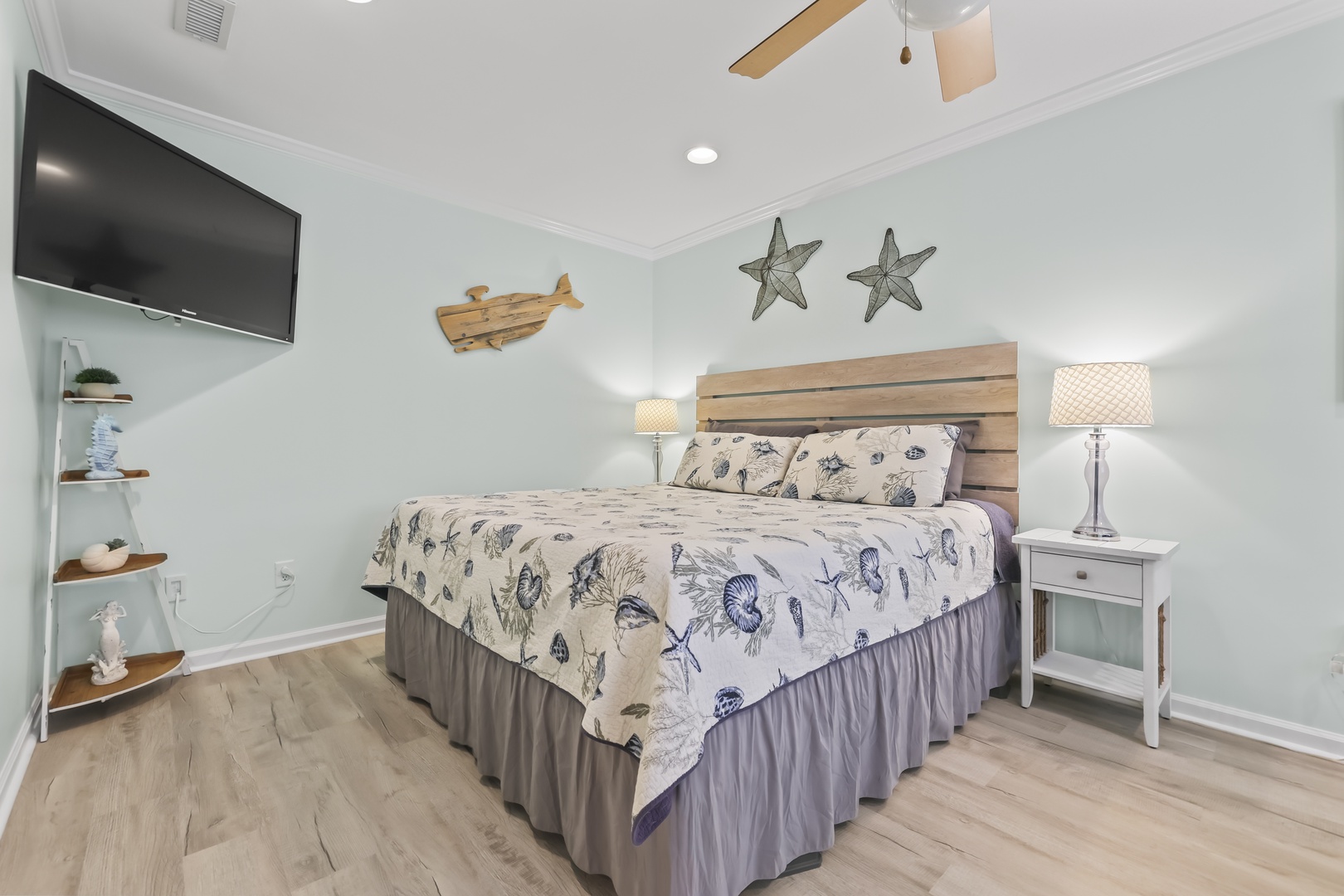 Drift off in your cozy coastal retreat, where soft bedding, charming nautical touches, and gentle lighting create the perfect sanctuary for rest and relaxation.