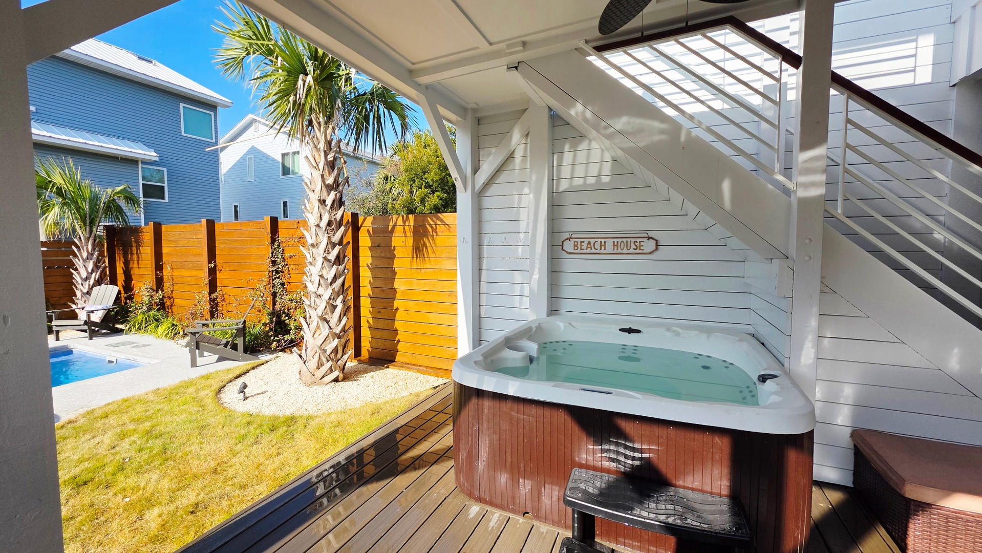 Soak in your private hot tub while gazing at swaying palms and your sparkling pool in this tropical paradise.