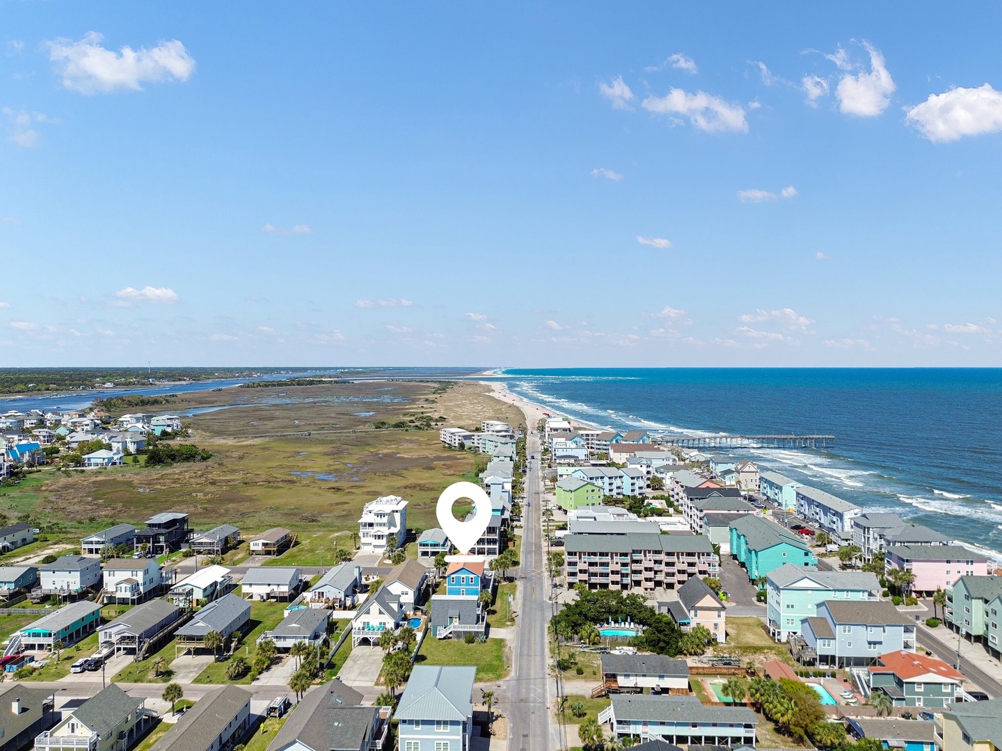 Aerial view showcasing the coastal community with oceanfront access and nearby residential neighborhoods.