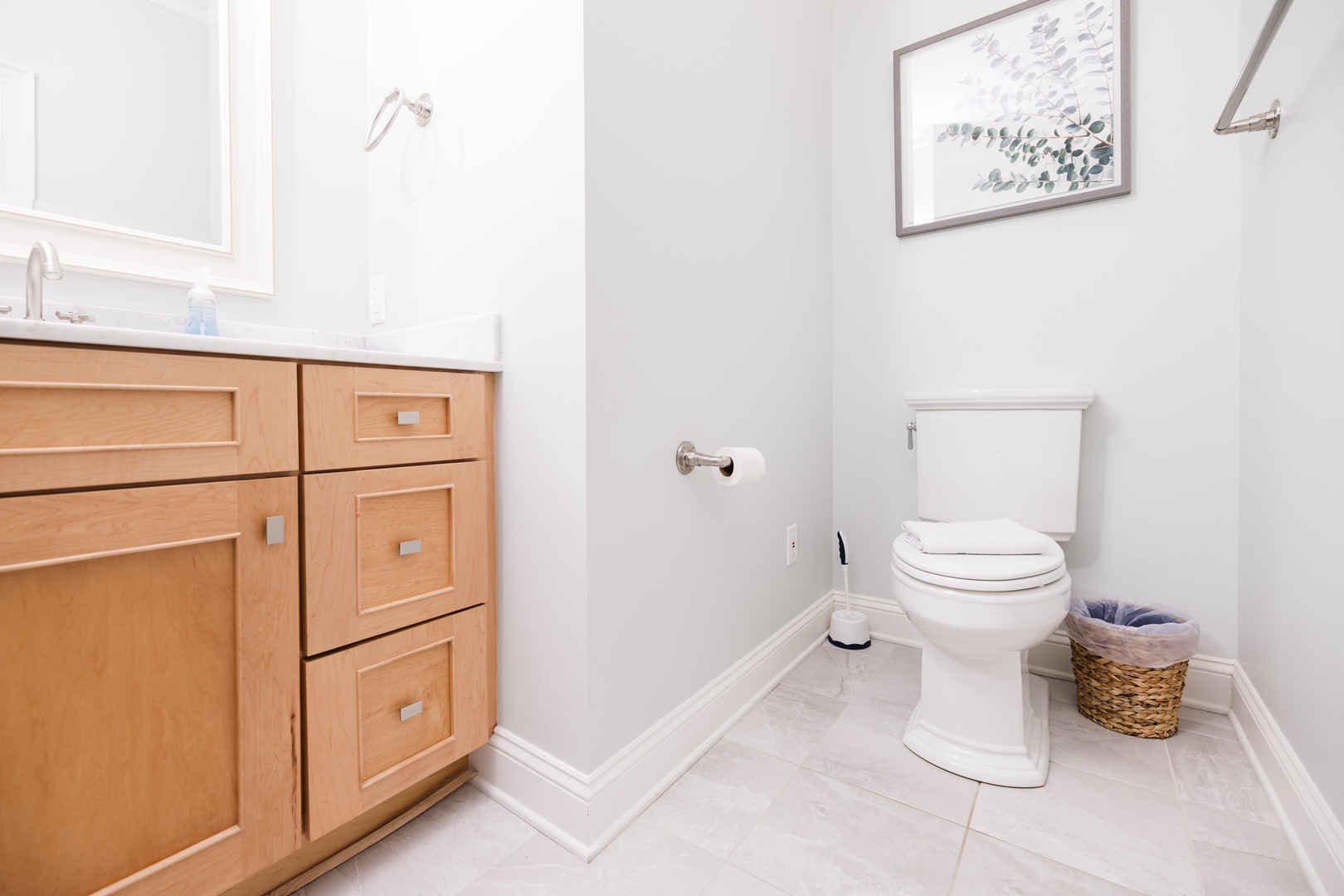 Step into your pristine private bathroom with warm wood cabinetry, marble countertops, and thoughtful touches that make you feel right at home.