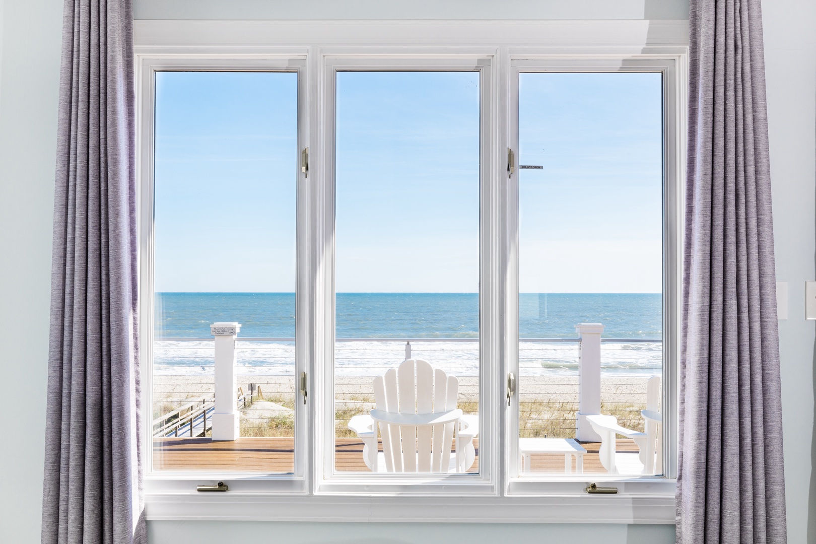 Wake up to stunning ocean waves just steps from your door, with beach chairs waiting on your private deck.