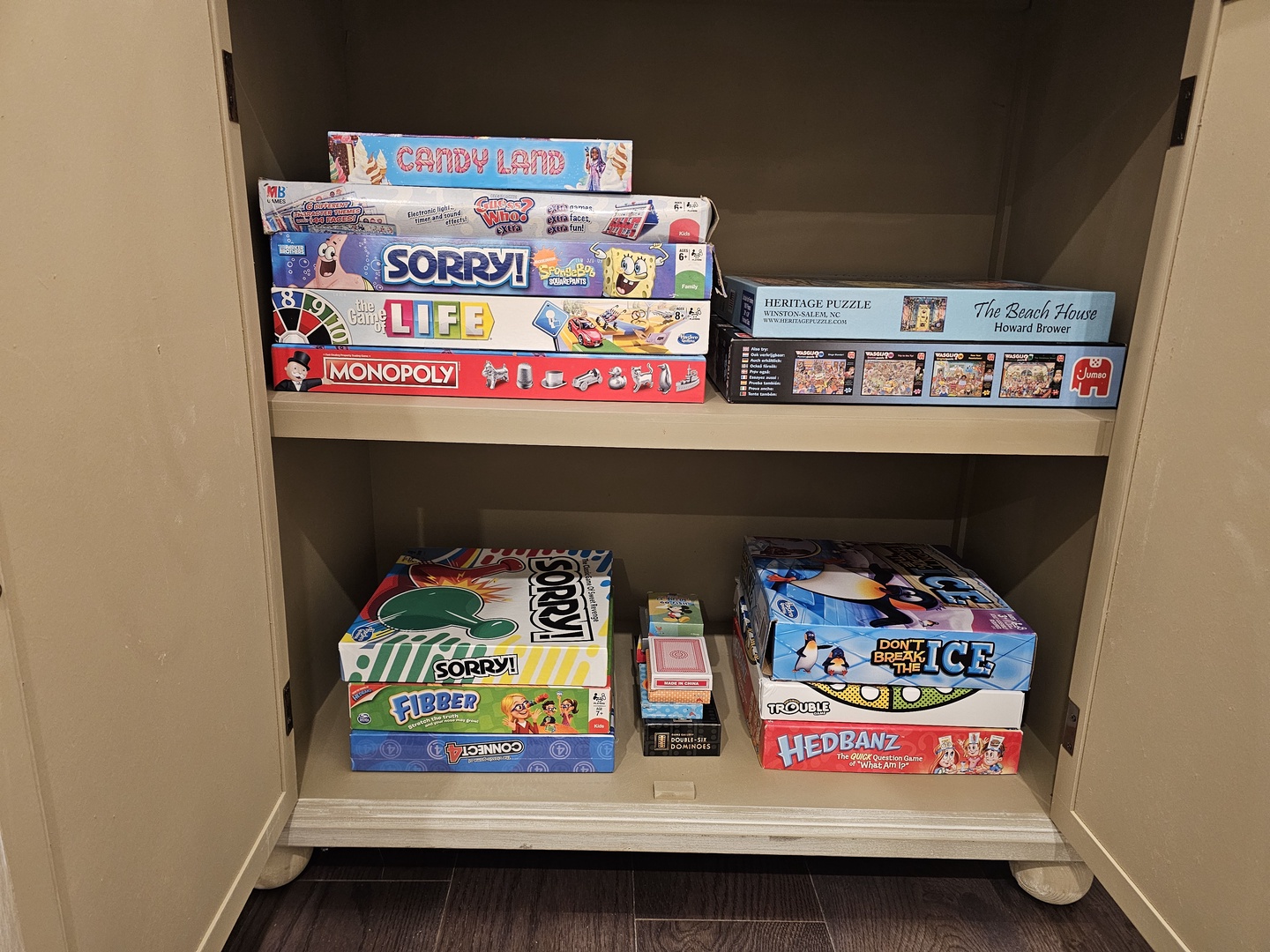 Gather your family for game night with classics like Monopoly, Sorry, and puzzles waiting in your entertainment cabinet.