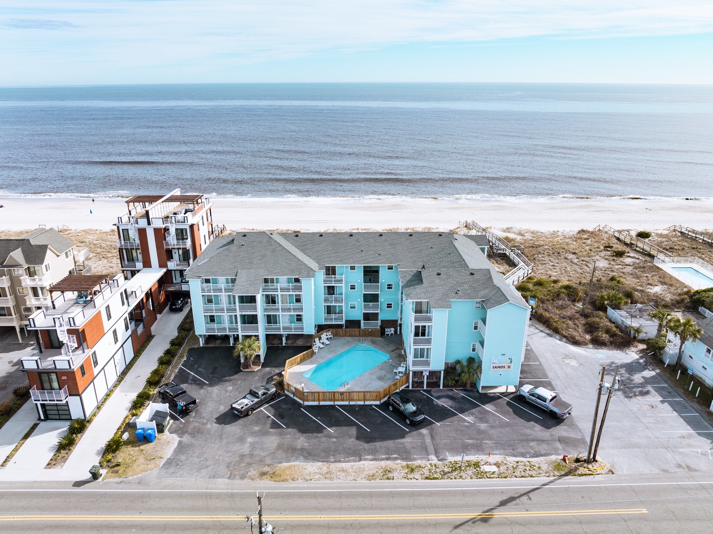 Coastal property features beachfront access with pristine sandy shores and sparkling ocean views just steps from your door.