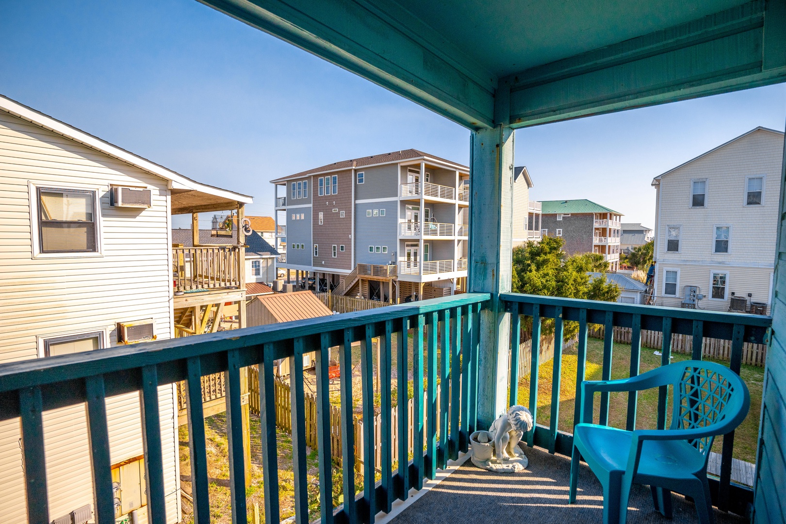 Step onto your private balcony and soak up the coastal charm while enjoying views of the colorful beach community around you.