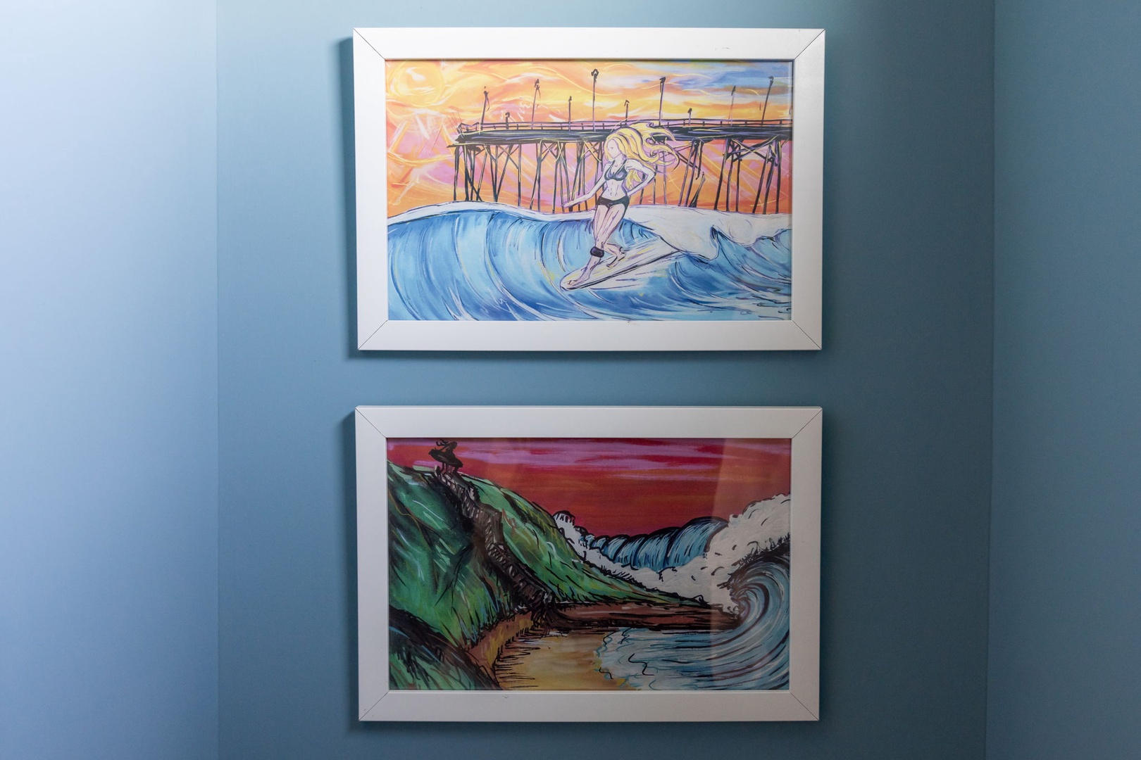 Admire vibrant coastal artwork adorning your wall, featuring surfers and ocean waves that bring seaside energy to your retreat.