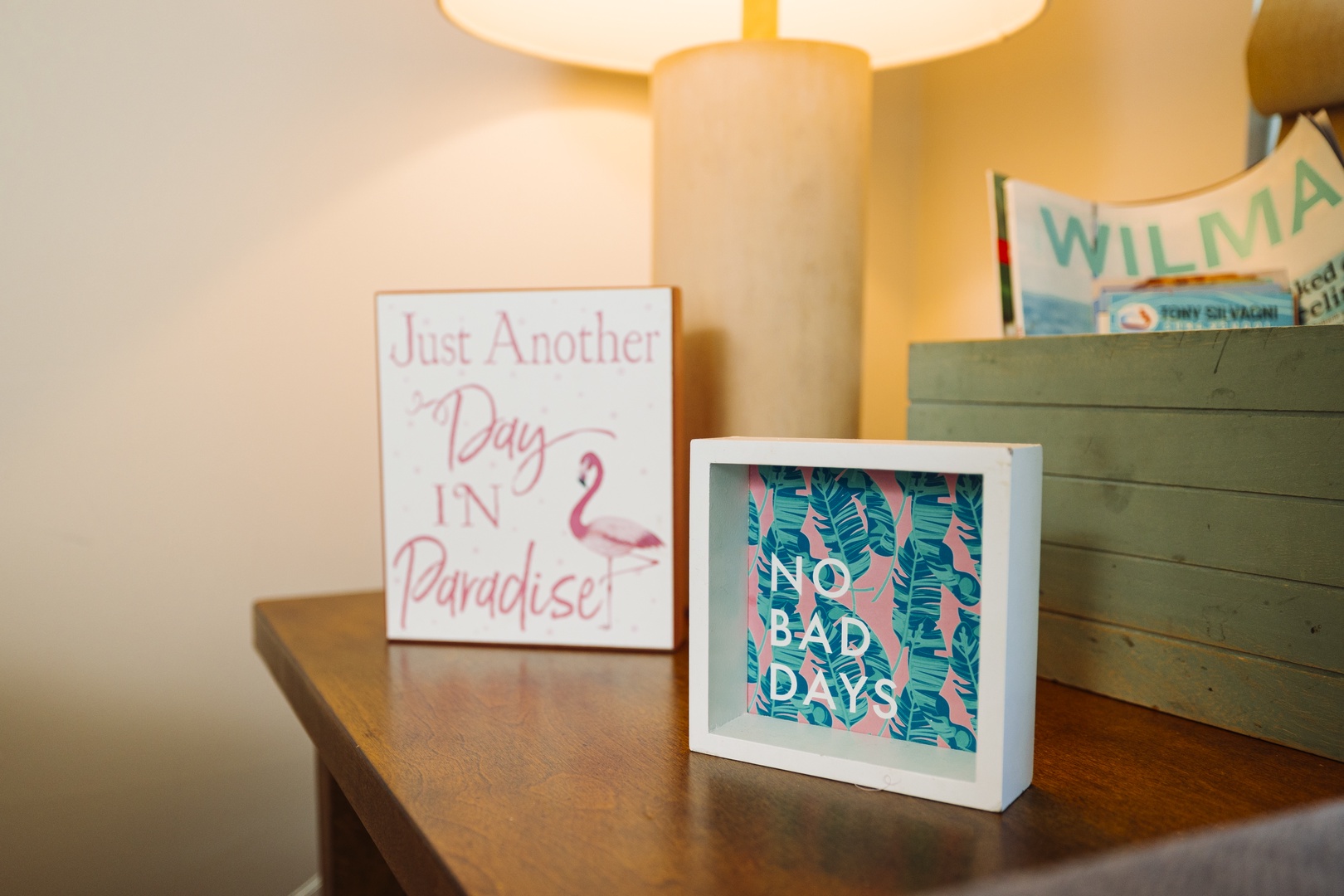 Charming vacation-themed décor adorns your nightstand, setting the perfect mood for tropical relaxation.