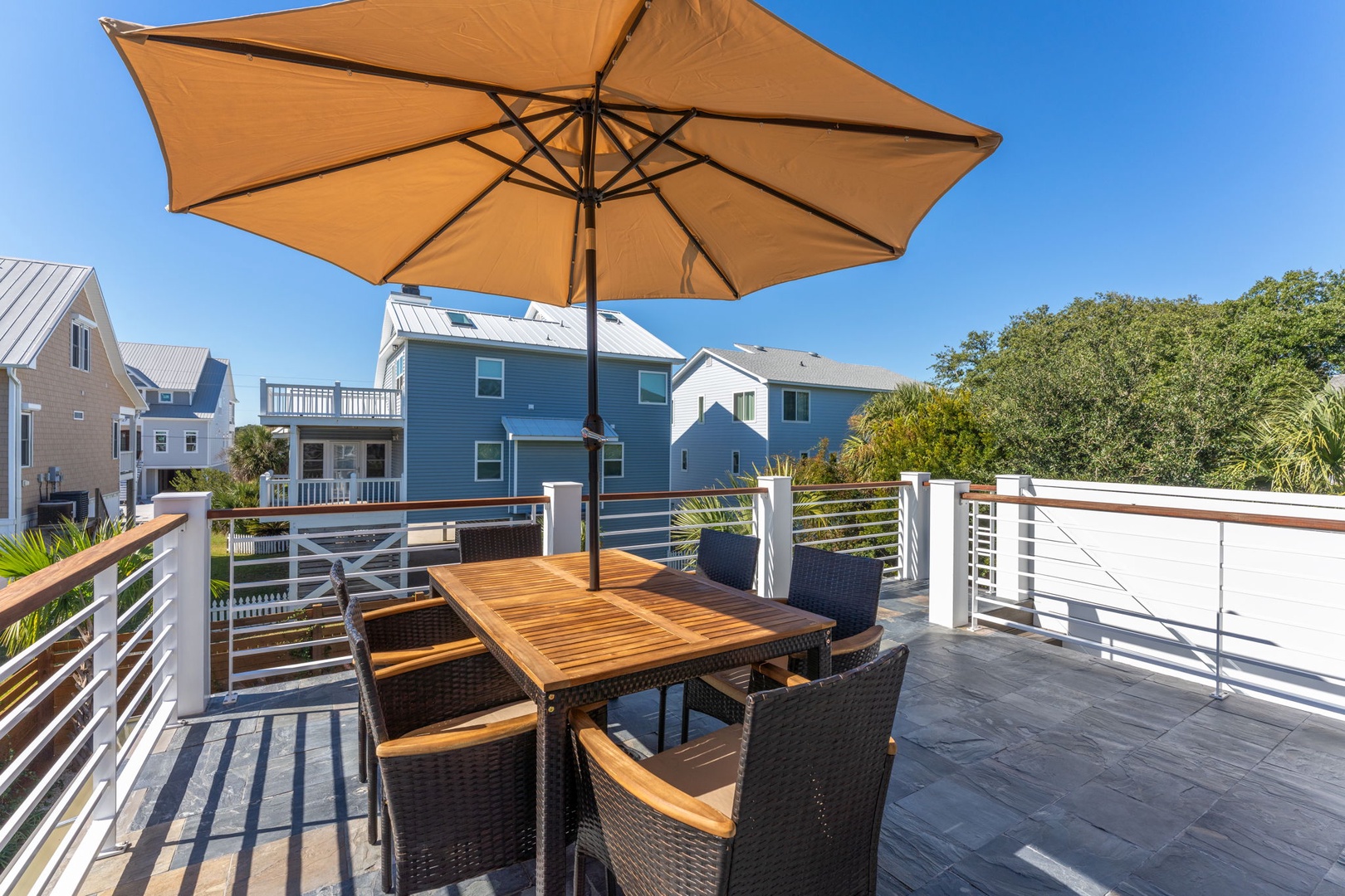 Savor your morning coffee or evening wine on this stunning rooftop terrace, where warm sun and gentle breezes create the perfect outdoor dining experience.