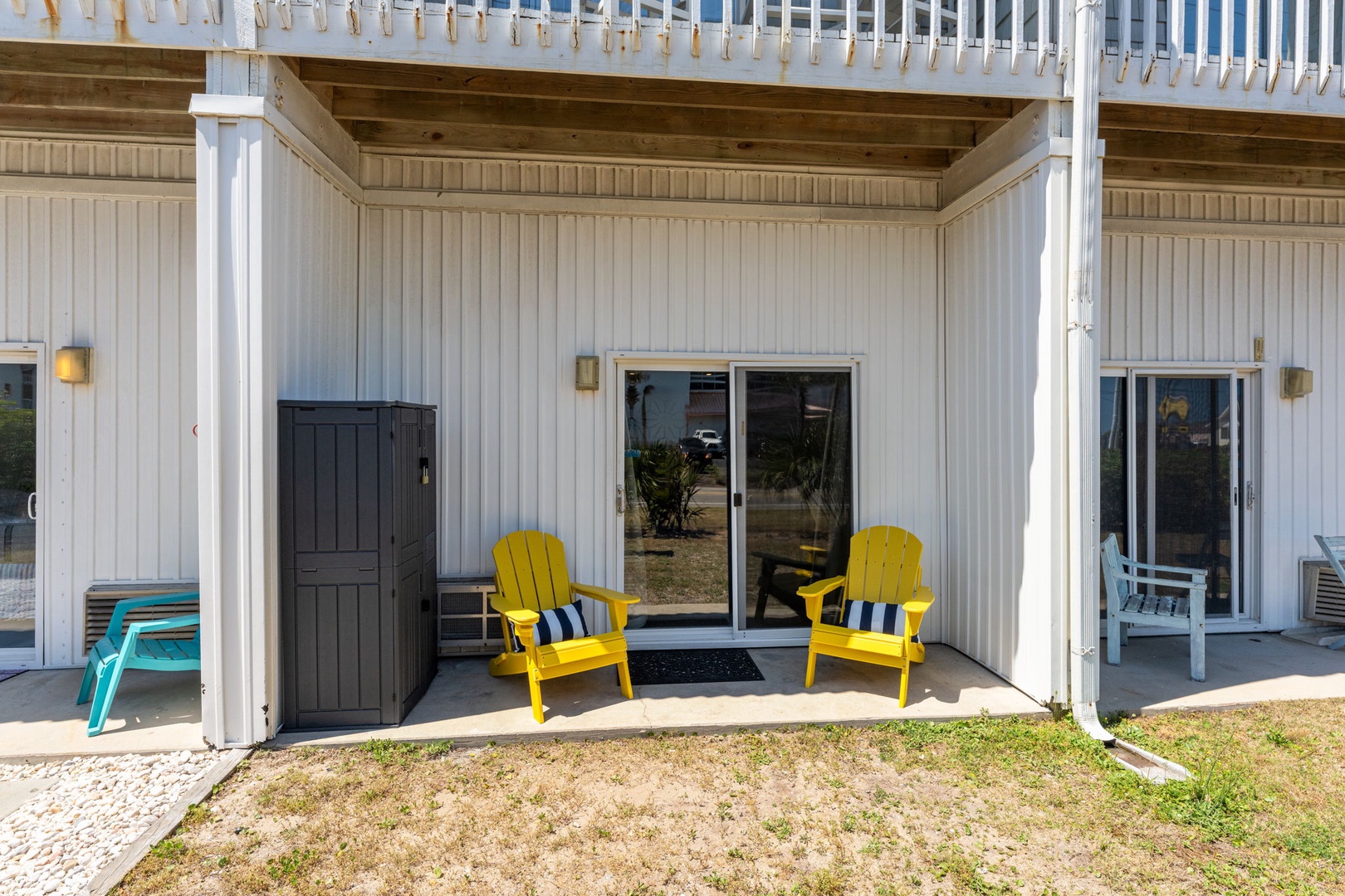 Relax in your bright yellow Adirondack chairs on the covered patio, perfect for morning coffee or evening conversations with ocean breezes.